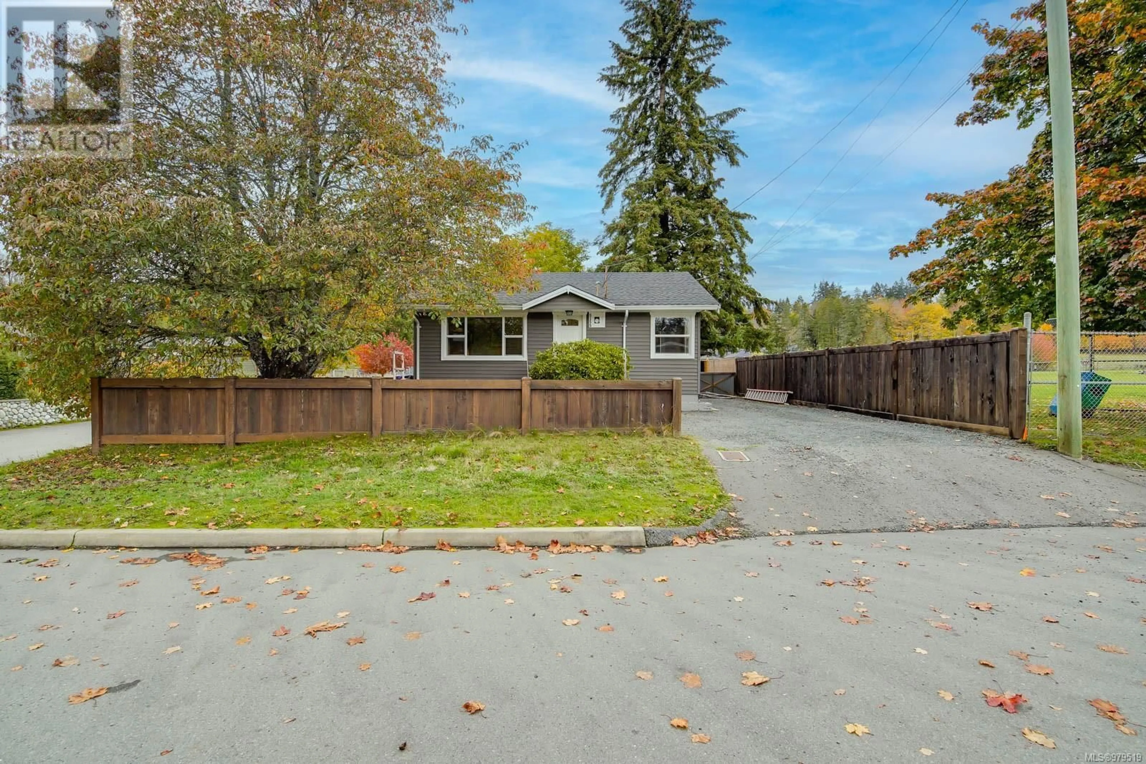 Frontside or backside of a home, the fenced backyard for 5155 Compton Rd, Port Alberni British Columbia V9Y7B5