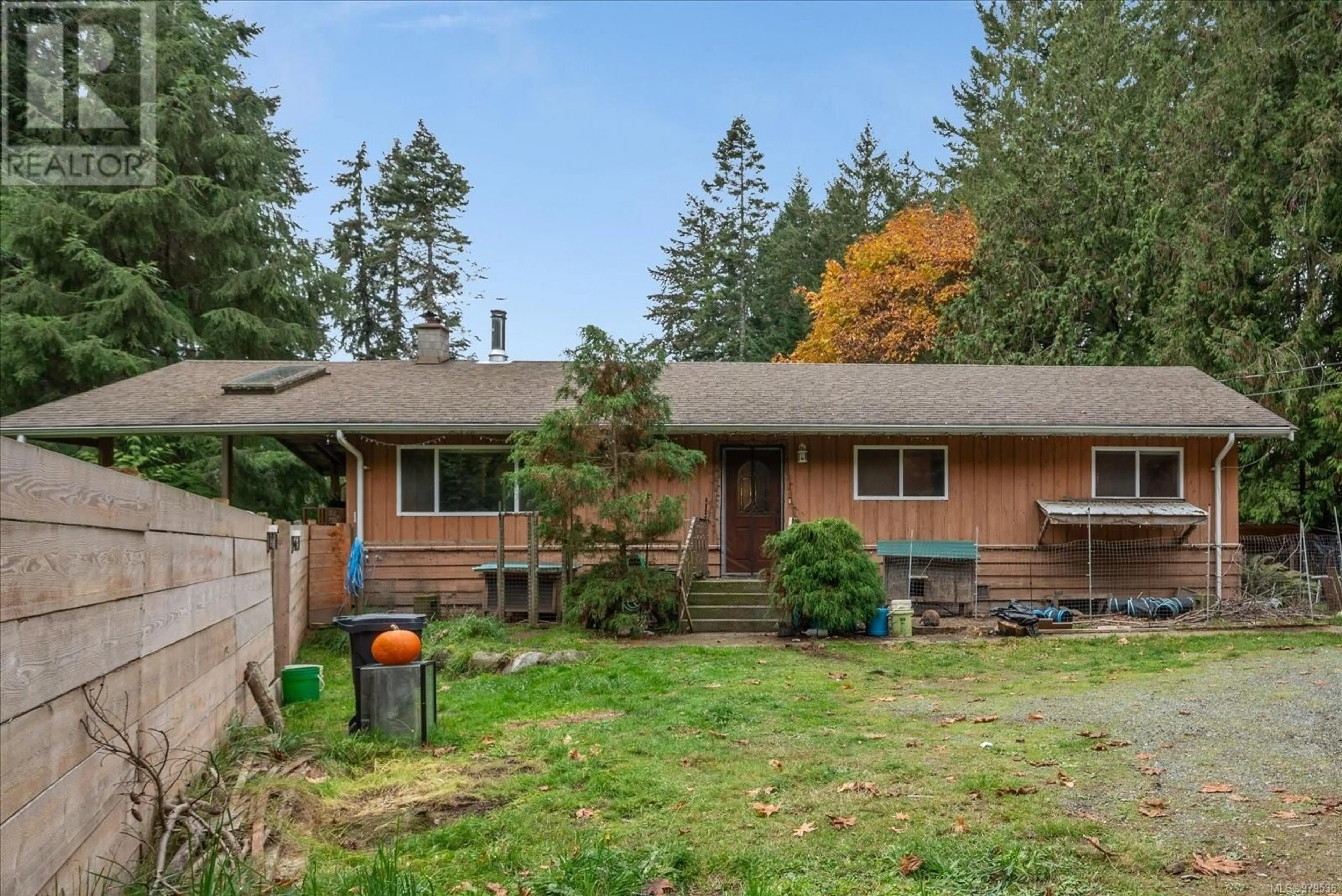 Frontside or backside of a home, the fenced backyard for 345 Larch Rd, Gabriola Island British Columbia V0R1X1