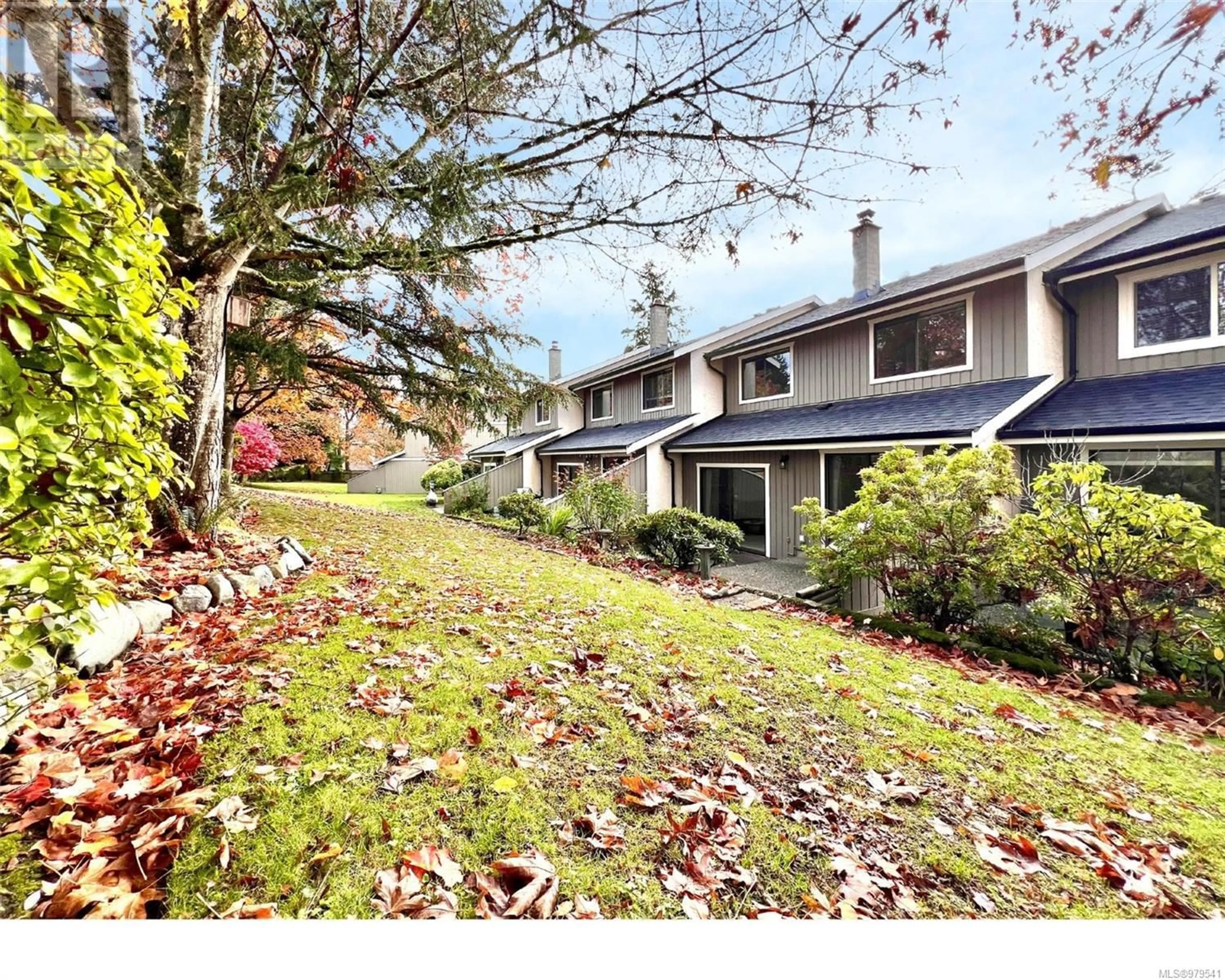 A pic from exterior of the house or condo, the fenced backyard for 13 1950 Cultra Ave, Central Saanich British Columbia V8M1Y9