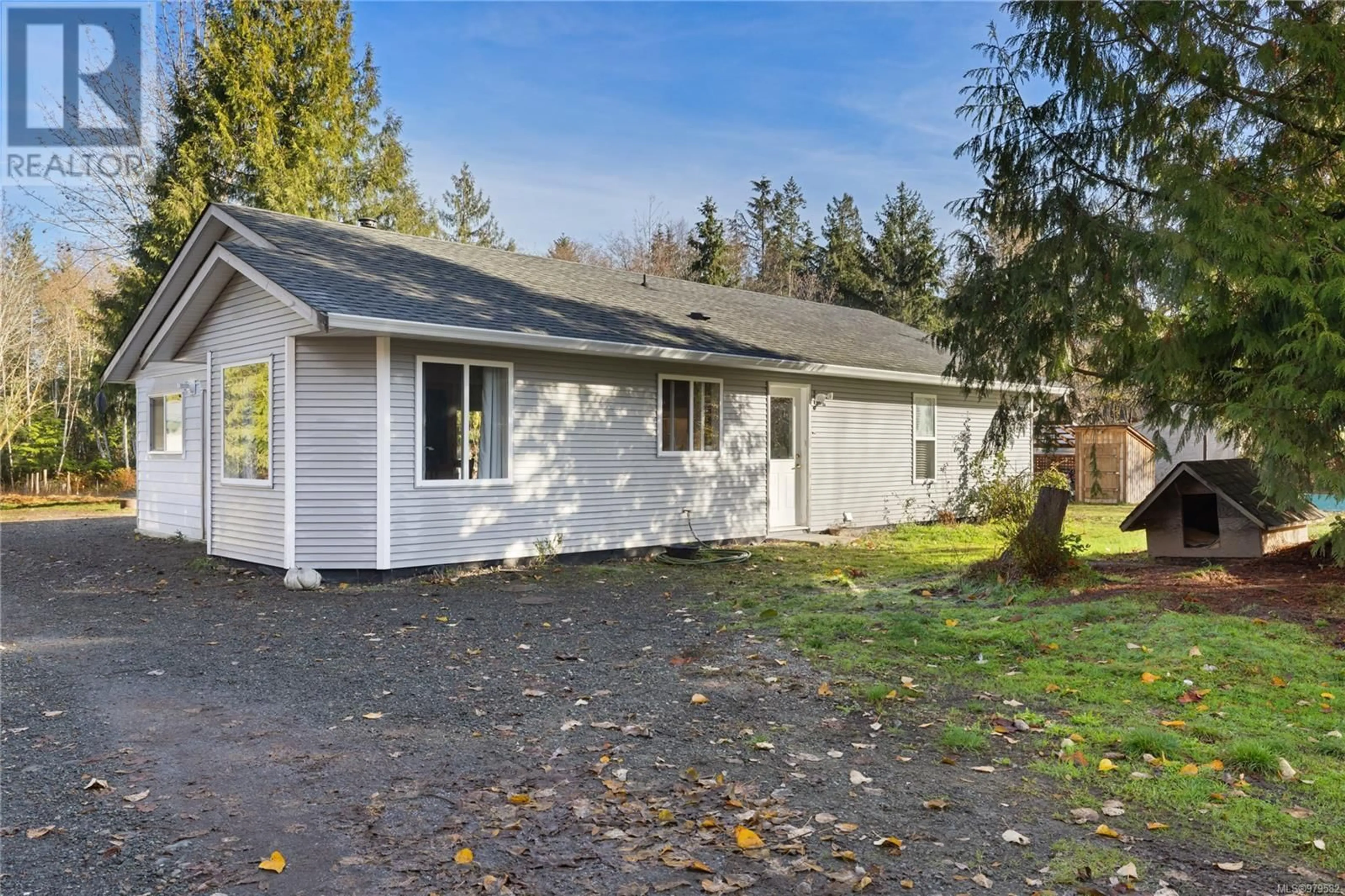 Frontside or backside of a home, the fenced backyard for 1726 Settler Rd, Qualicum Beach British Columbia V9K2R6