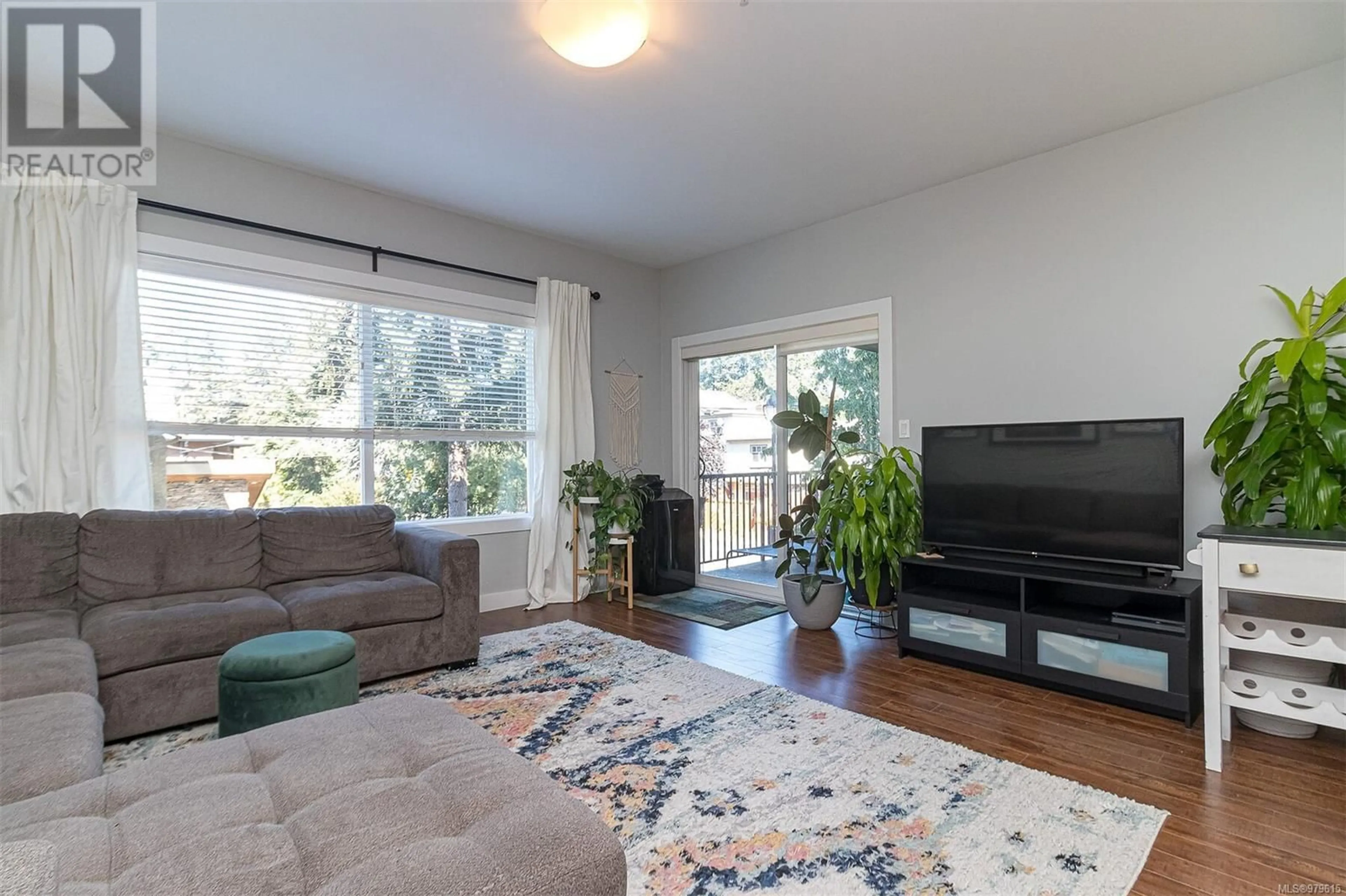 Living room, wood floors for 202 703 Massie Dr, Langford British Columbia V9B3A9