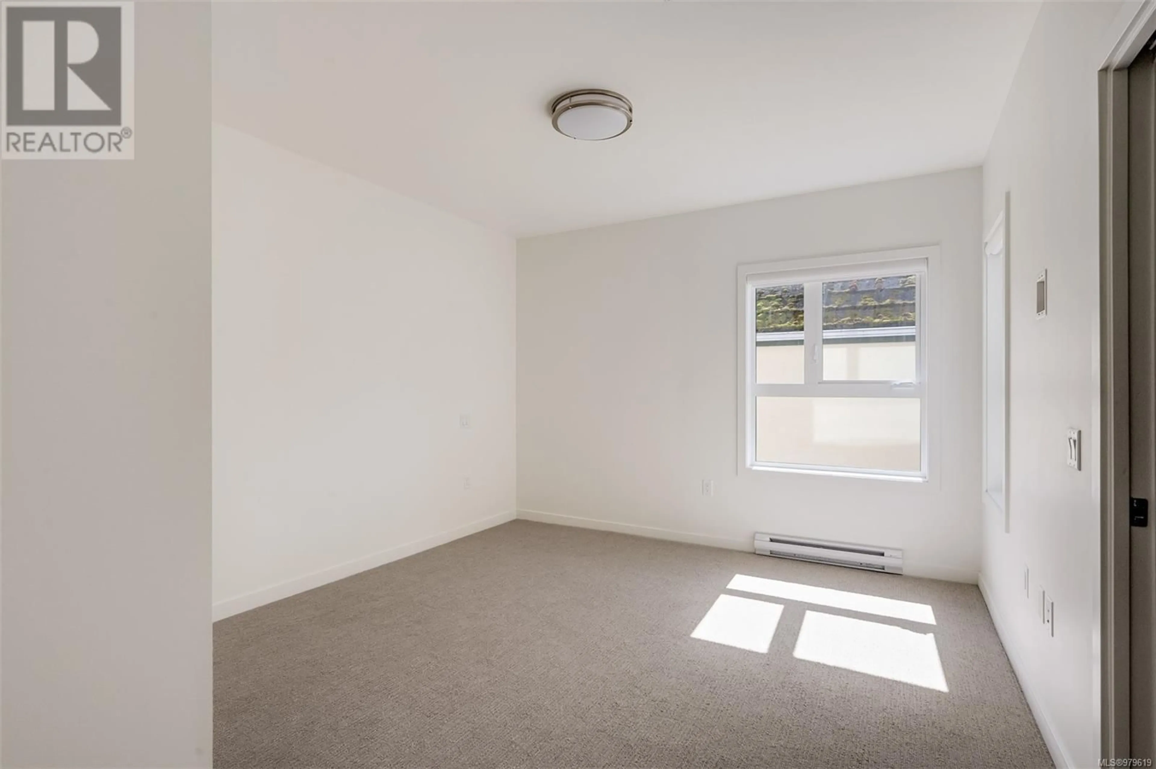 A pic of a room, not visible floor for 403 9716 Third St, Sidney British Columbia V8L3A2