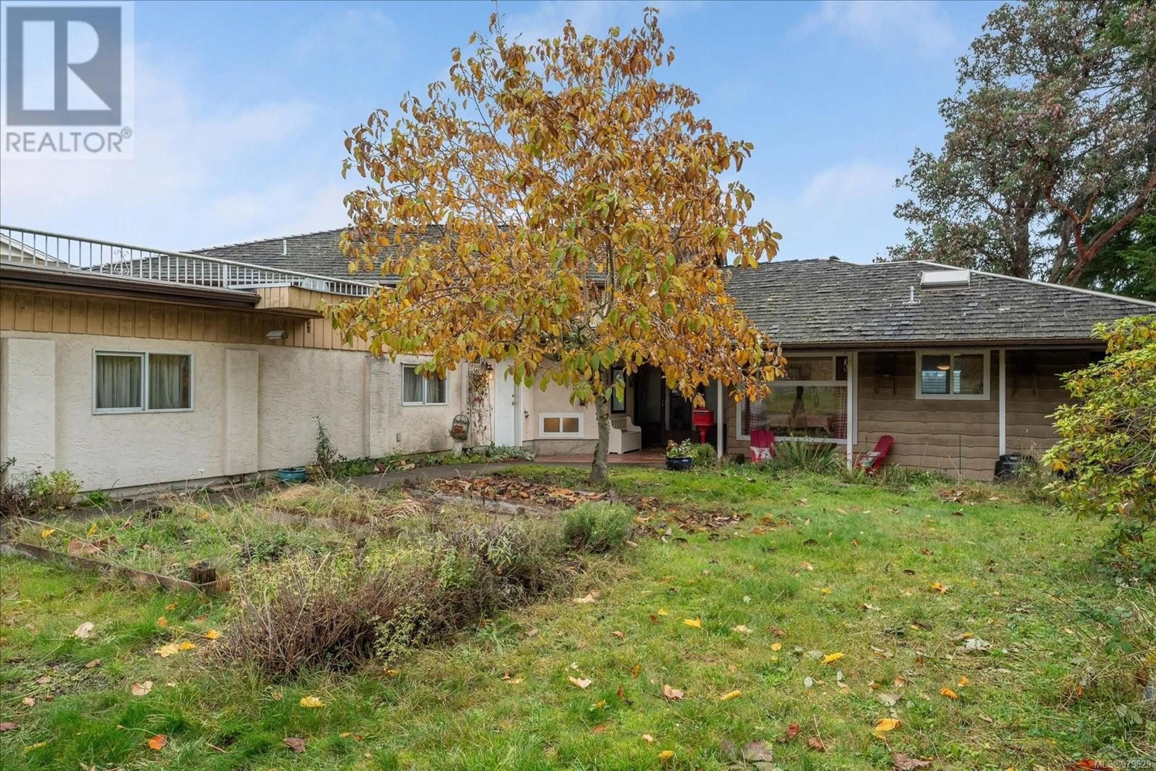 A pic from exterior of the house or condo, the fenced backyard for 165 Cilaire Dr, Nanaimo British Columbia V9S3E2