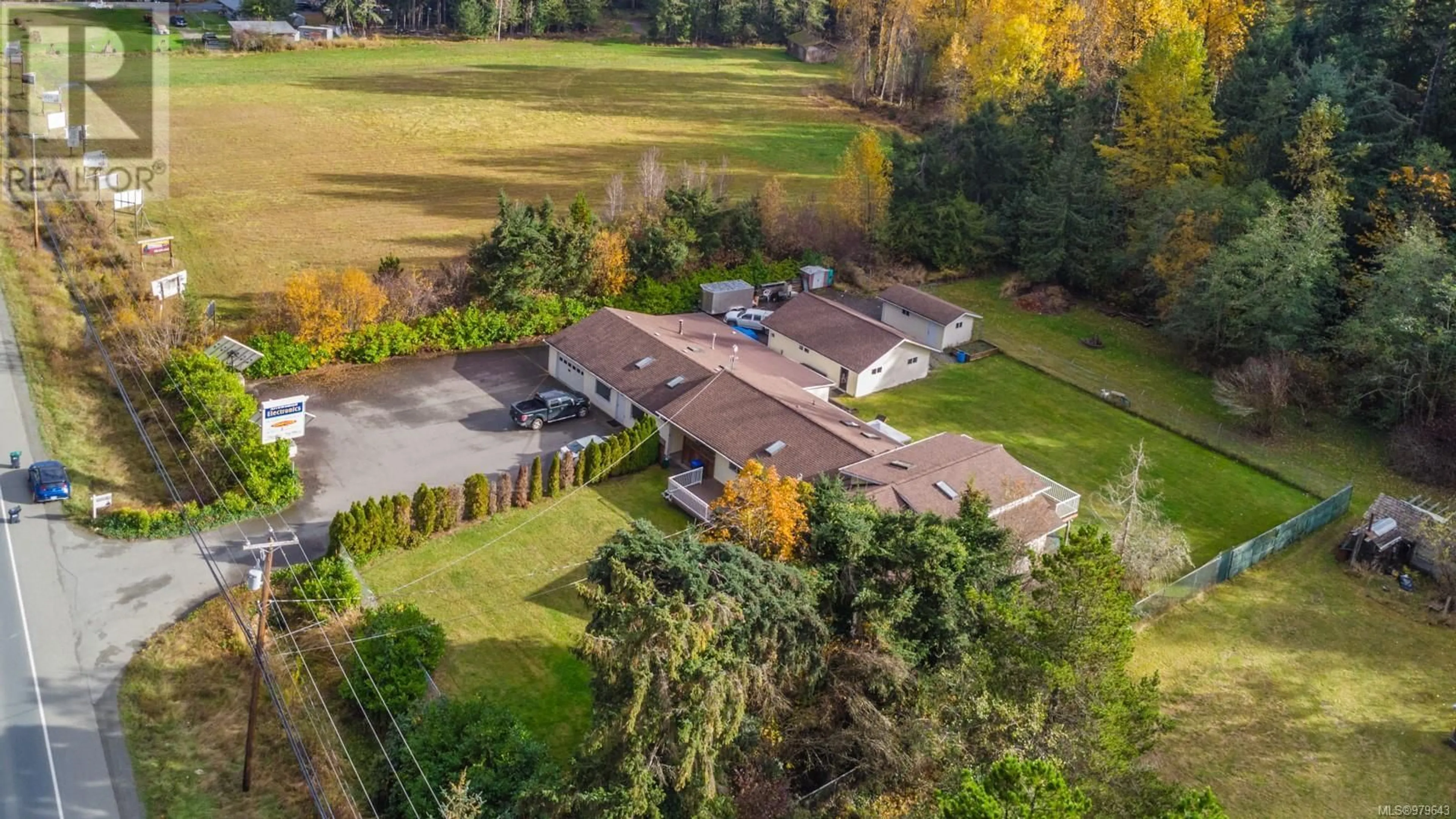 A pic from exterior of the house or condo, the fenced backyard for 2196 Alberni Hwy, Coombs British Columbia V0R1M0