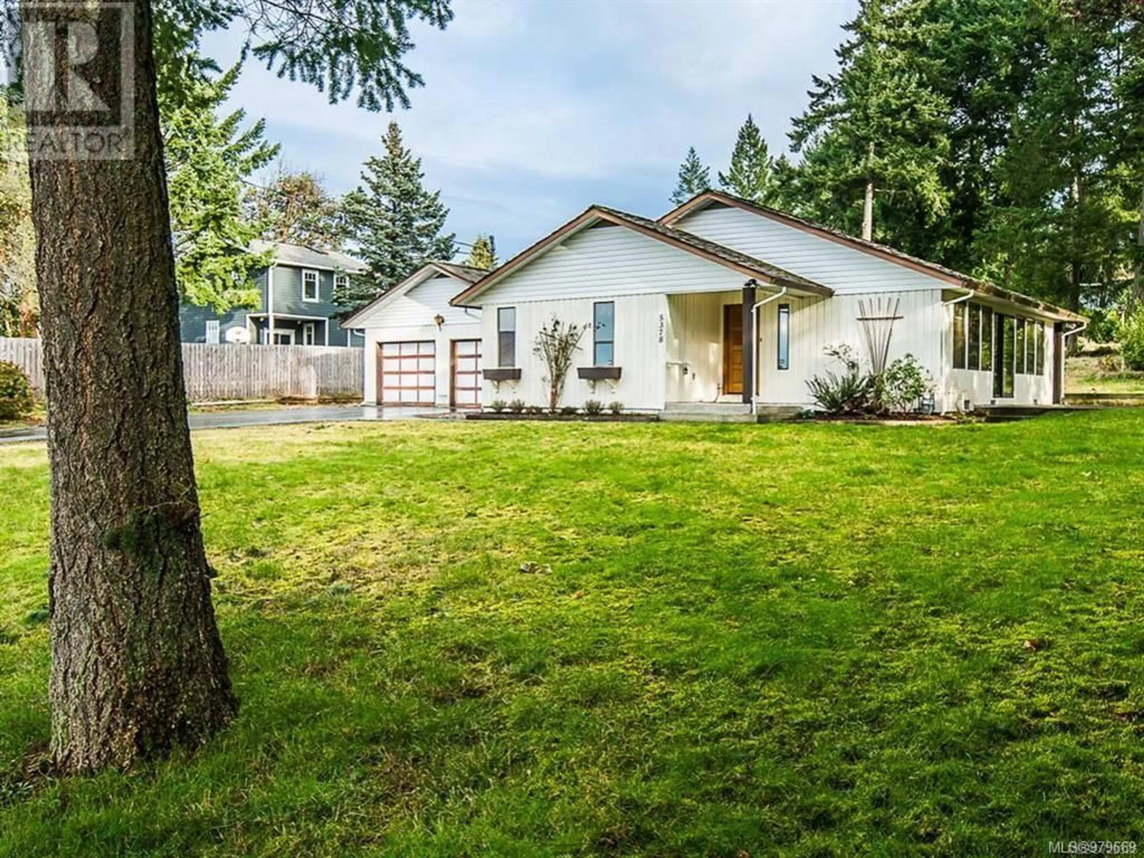 Frontside or backside of a home, the fenced backyard for 5378 Rutherford Rd, Nanaimo British Columbia V9T5N9