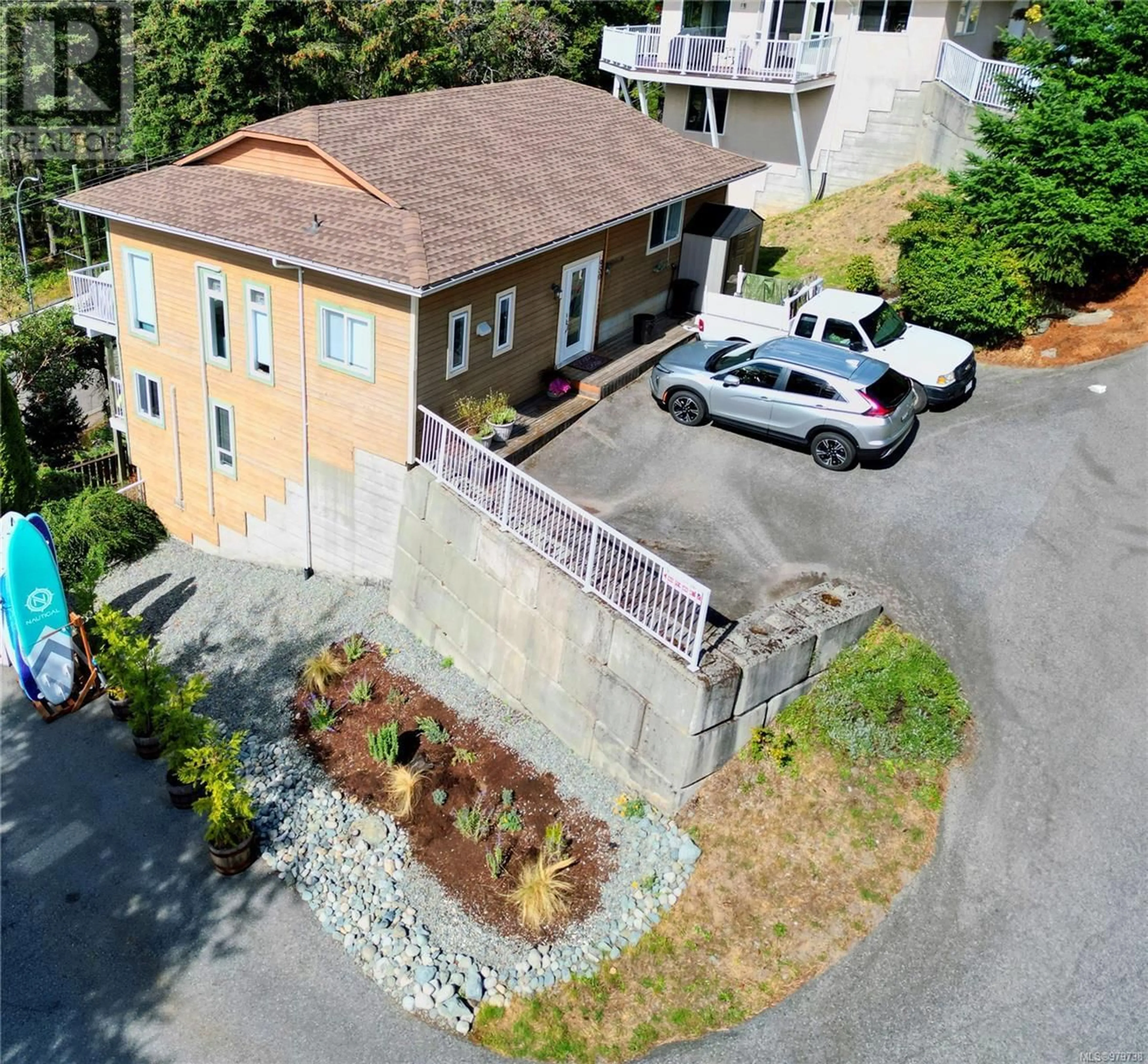 A pic from exterior of the house or condo, the street view for 950 Woodpecker Lane, Nanaimo British Columbia V9T5J7