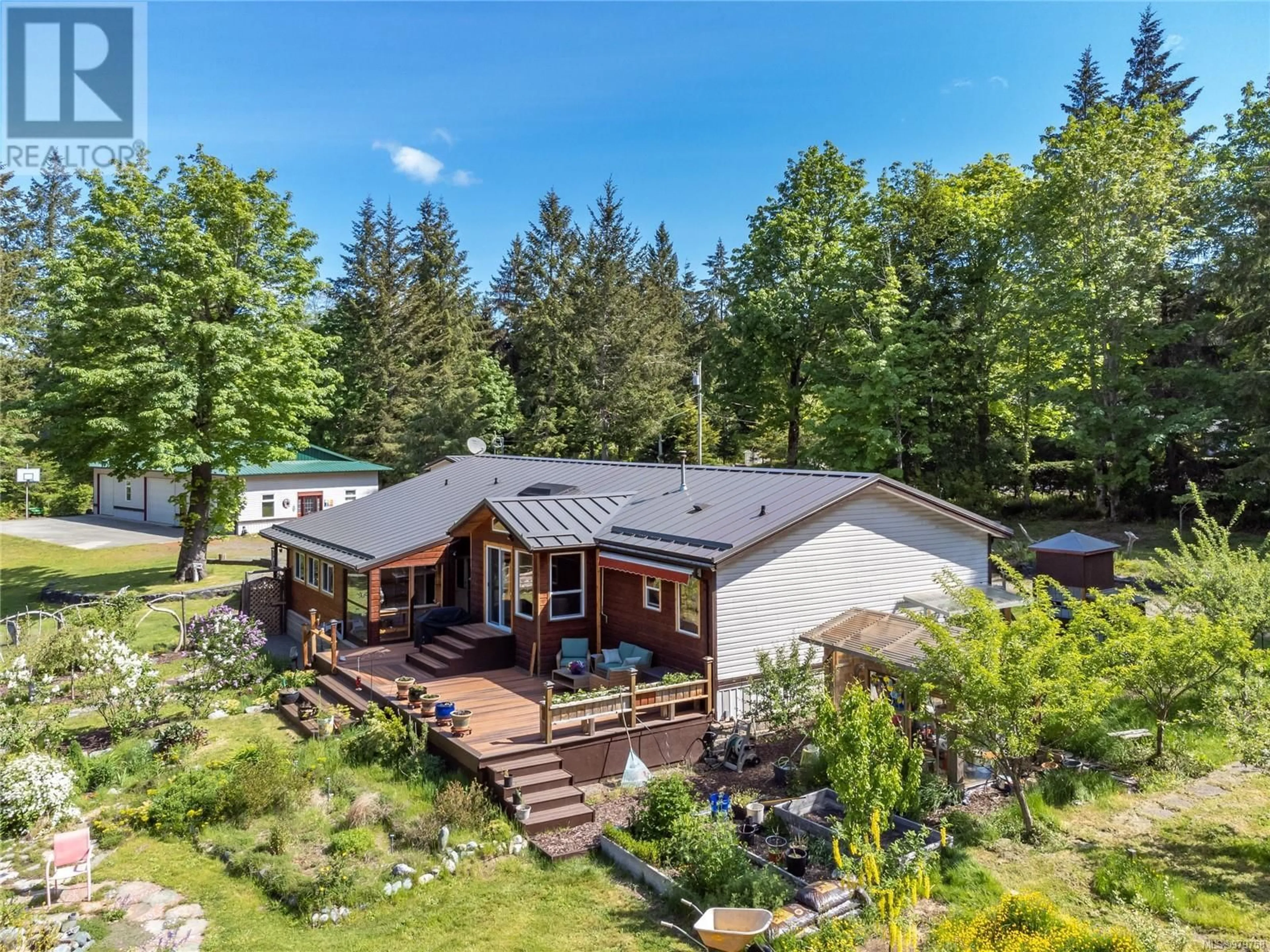 Frontside or backside of a home, cottage for 591 Green Rd, Quadra Island British Columbia V0P1H0