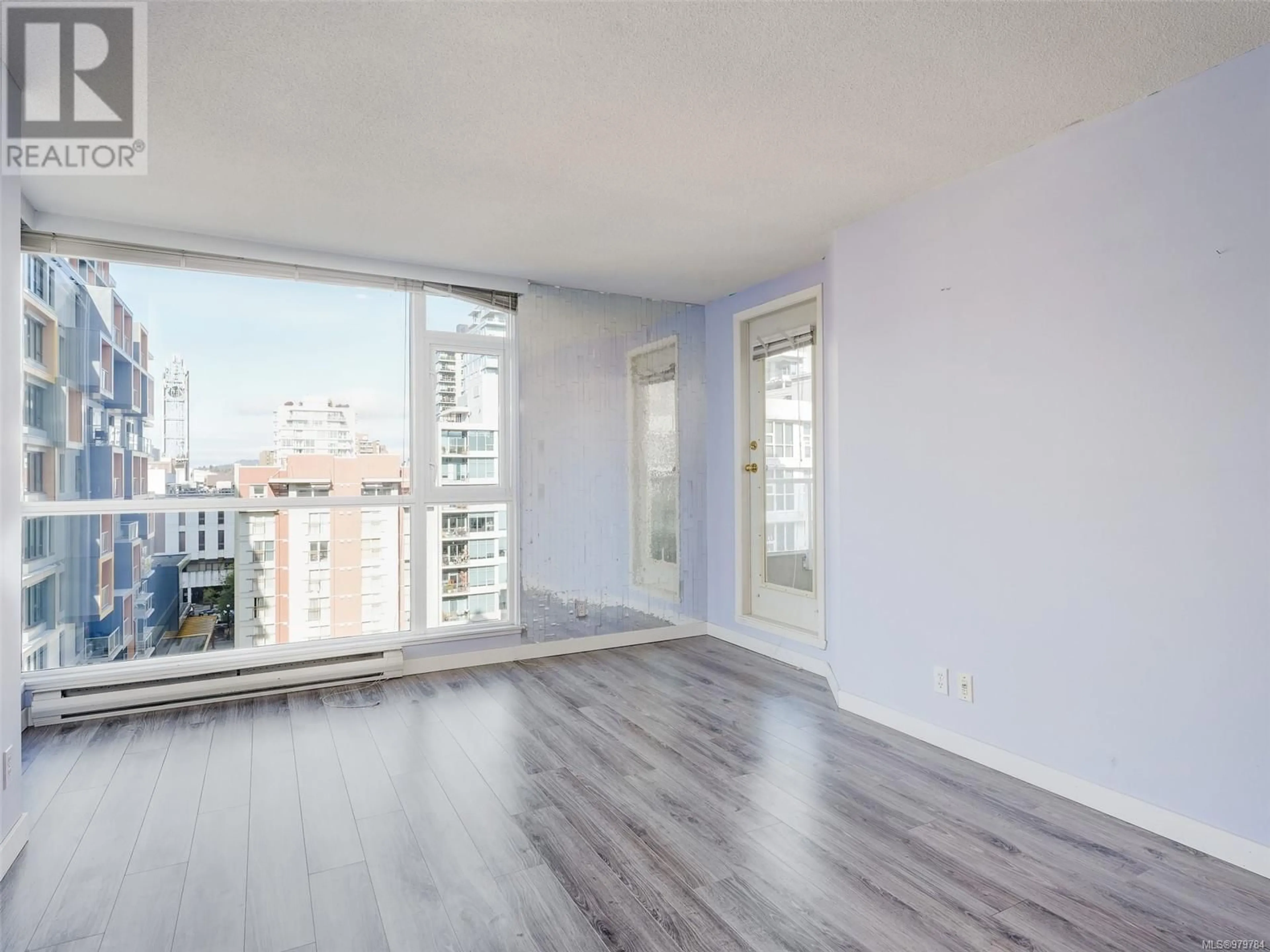 A pic of a room, wood floors for 807 835 View St, Victoria British Columbia V8W1K1