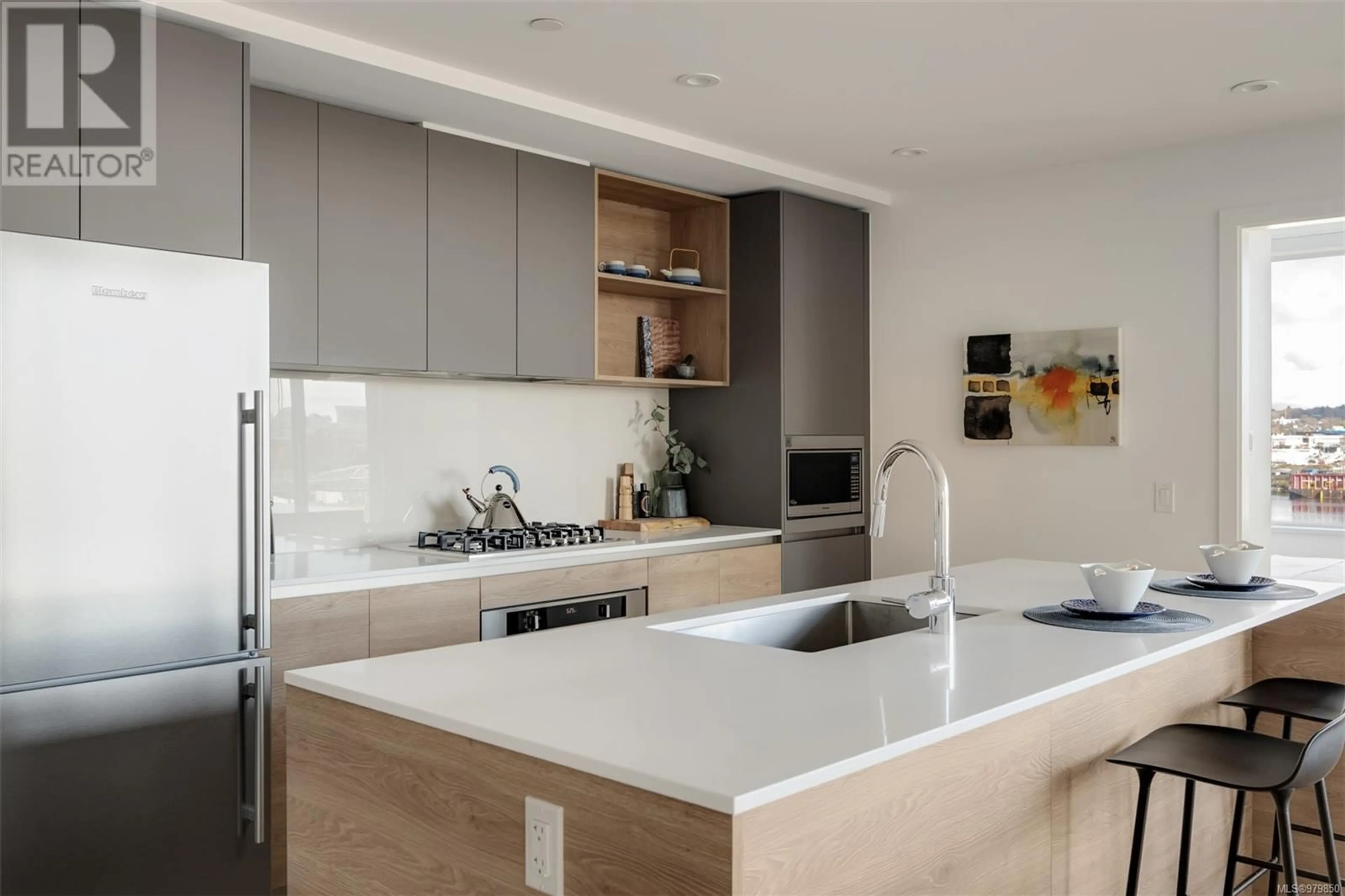 Contemporary kitchen, wood floors for 403 369 Tyee Rd, Victoria British Columbia V9A0B5