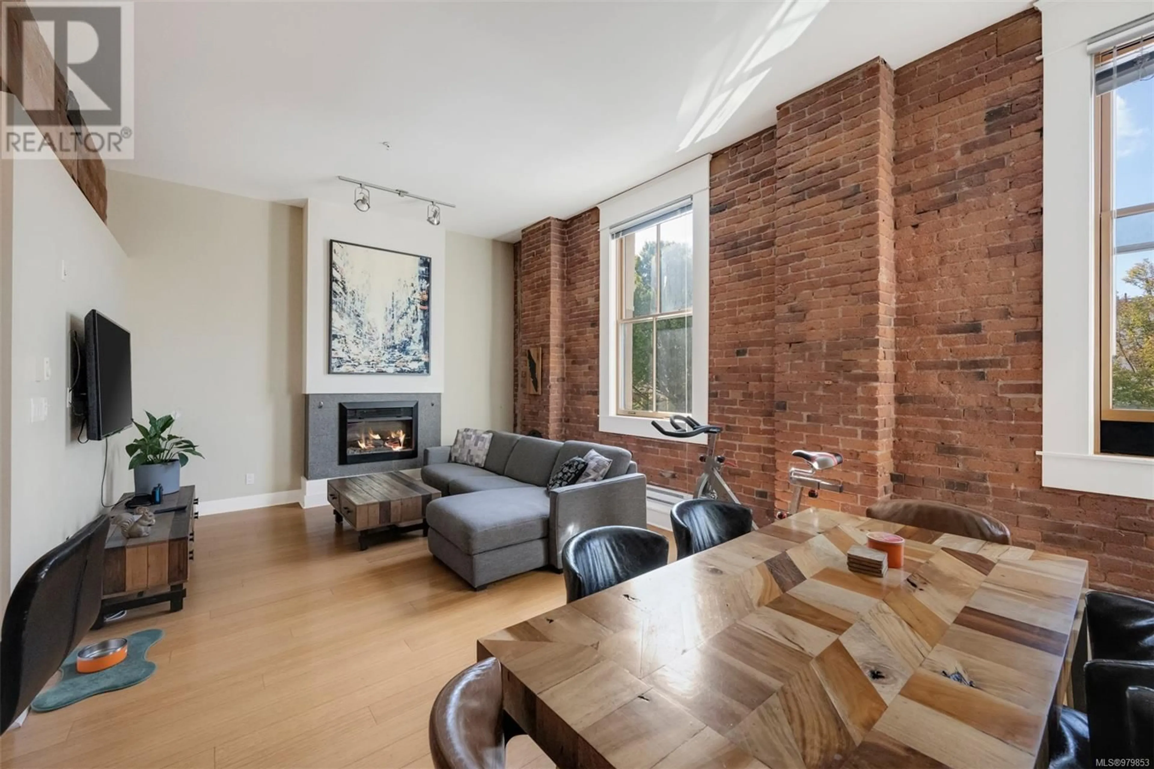 Living room, wood floors for 203 610 Johnson St, Victoria British Columbia V8W1M4