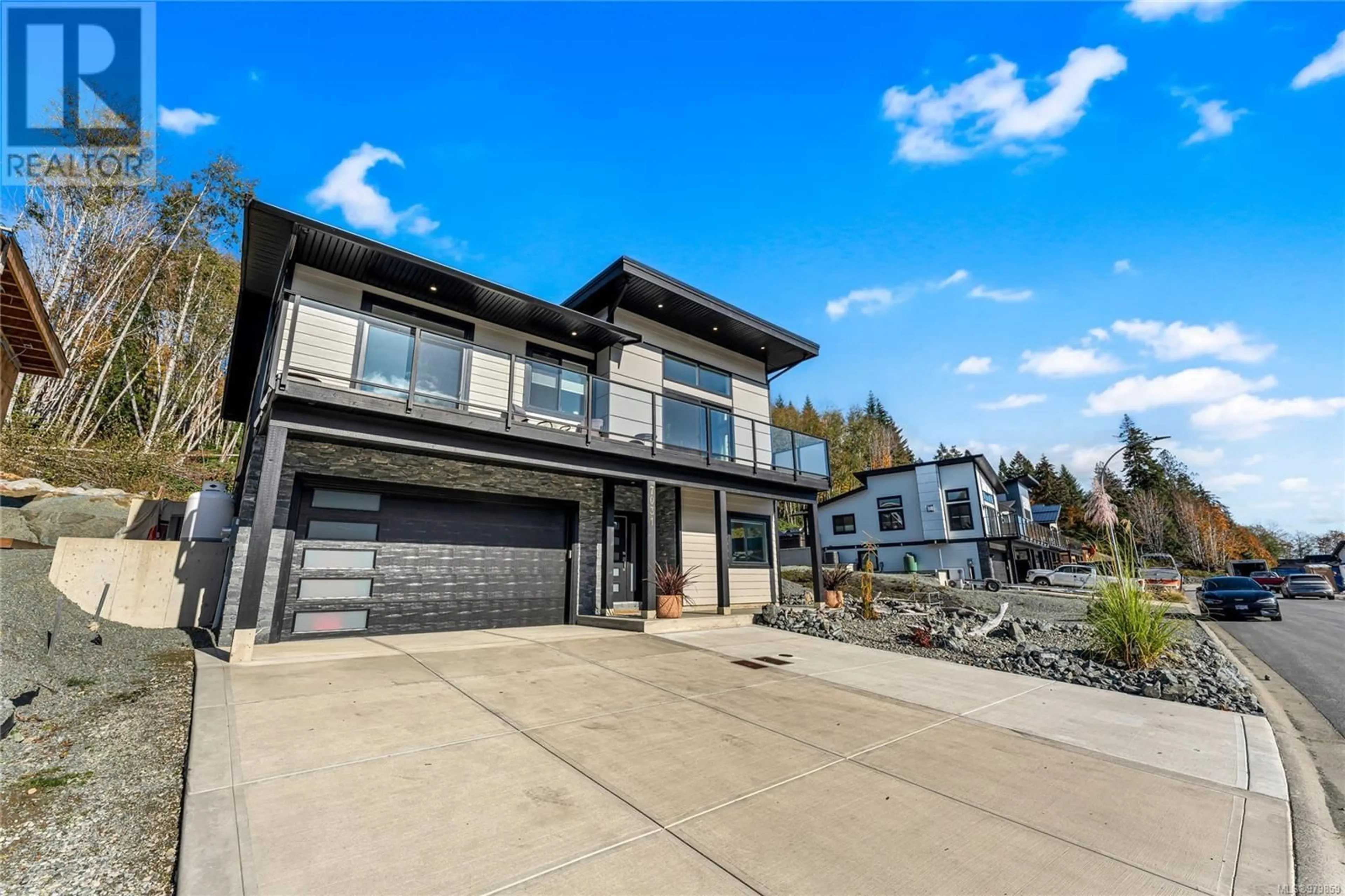 Frontside or backside of a home, the street view for 7031 Sha-elum Dr, Lake Cowichan British Columbia V0R2G0