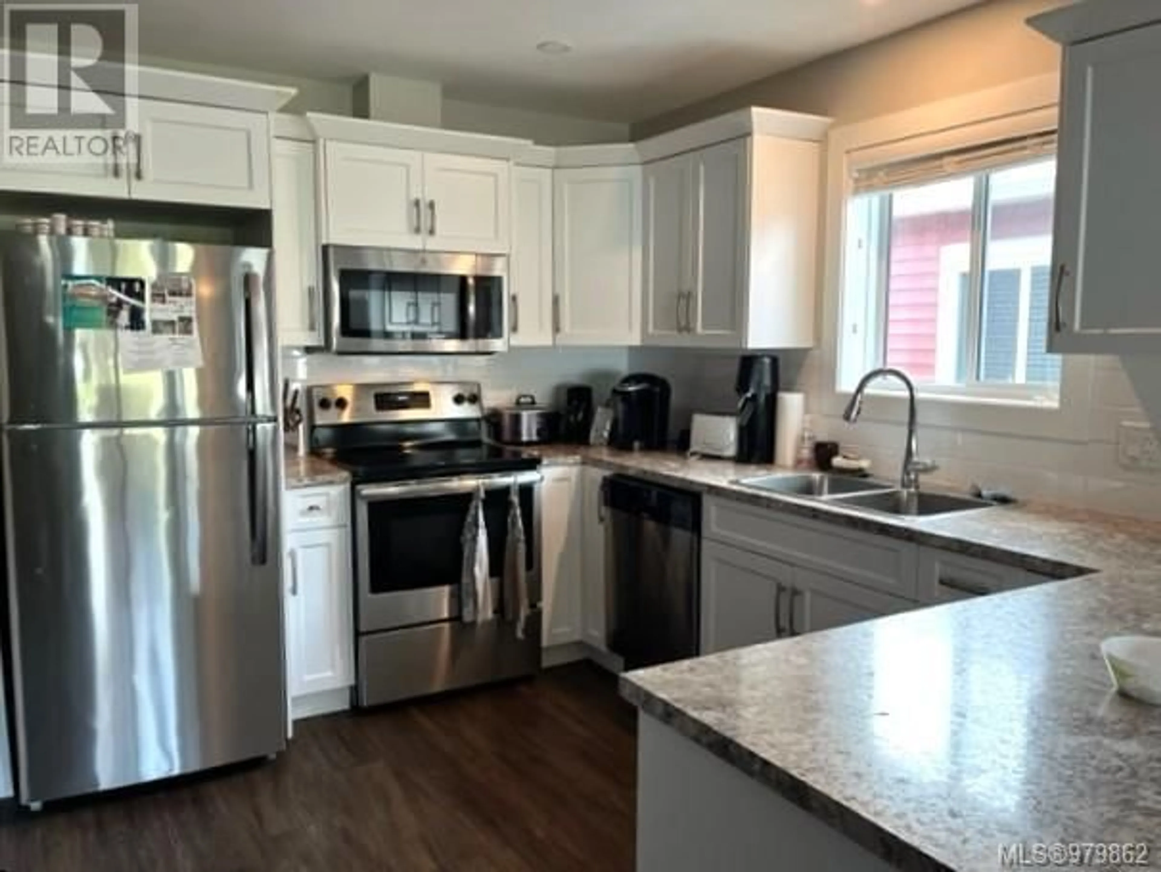 Open concept kitchen for 106 5700 Pierce Rd, Port Alberni British Columbia V9Y0A3