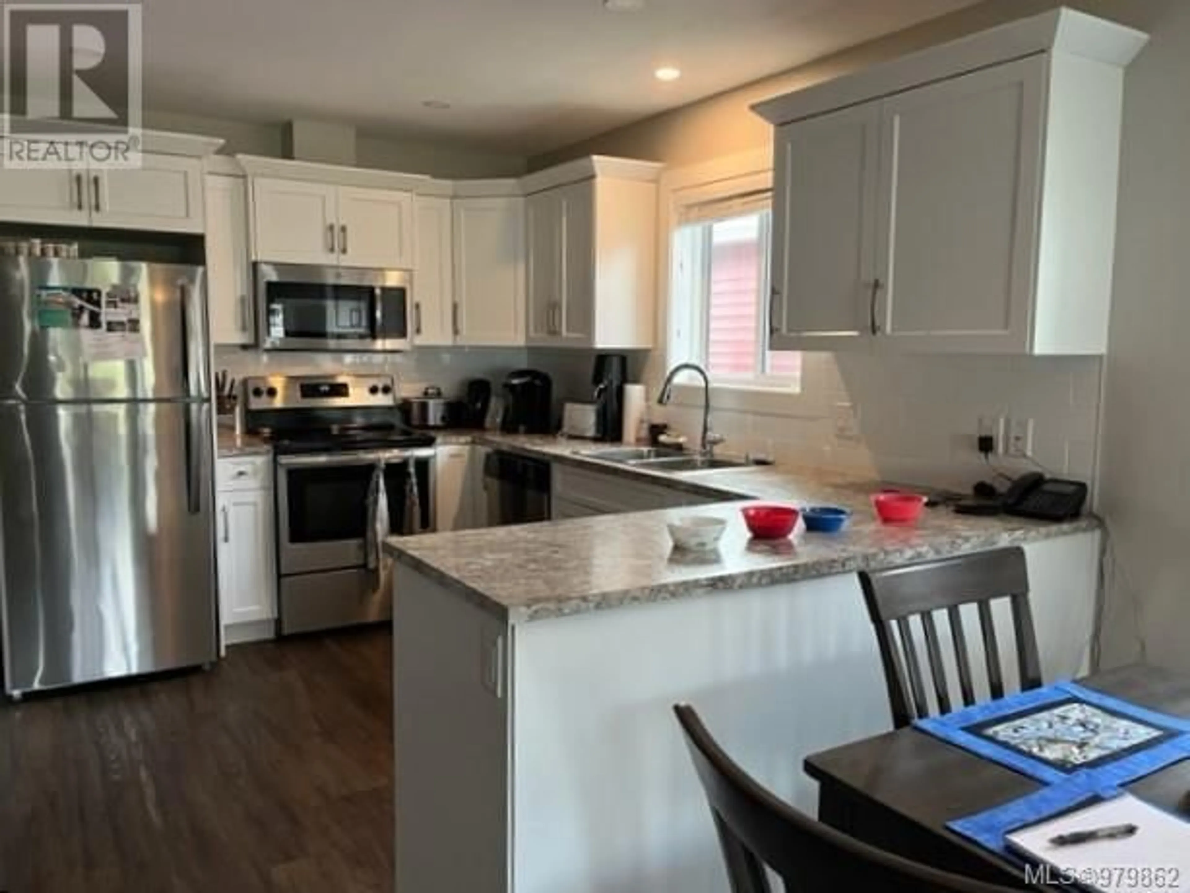 Open concept kitchen for 106 5700 Pierce Rd, Port Alberni British Columbia V9Y0A3