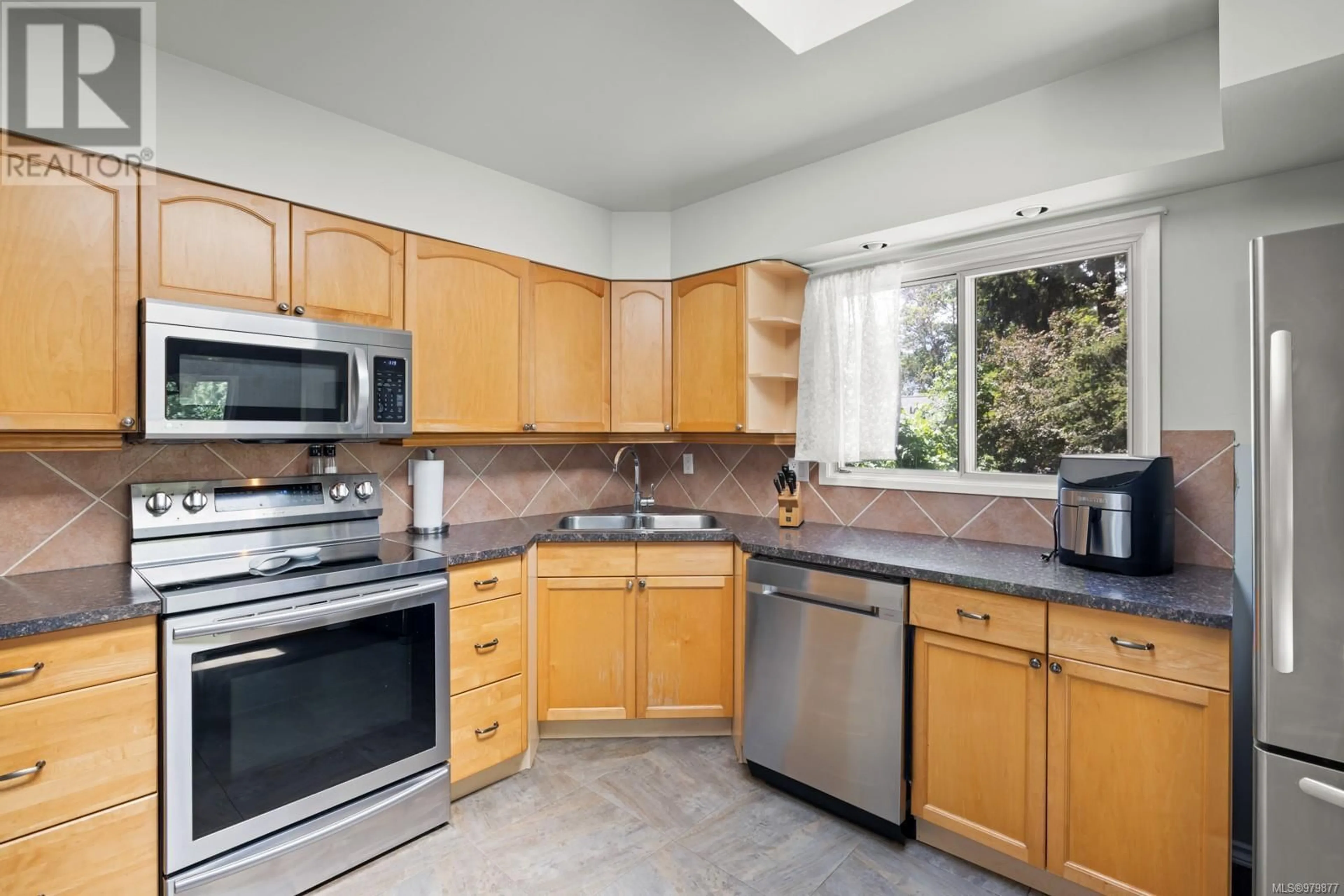 Standard kitchen, wood floors, cottage for 3188 Glen Lake Rd, Langford British Columbia V9B4B7