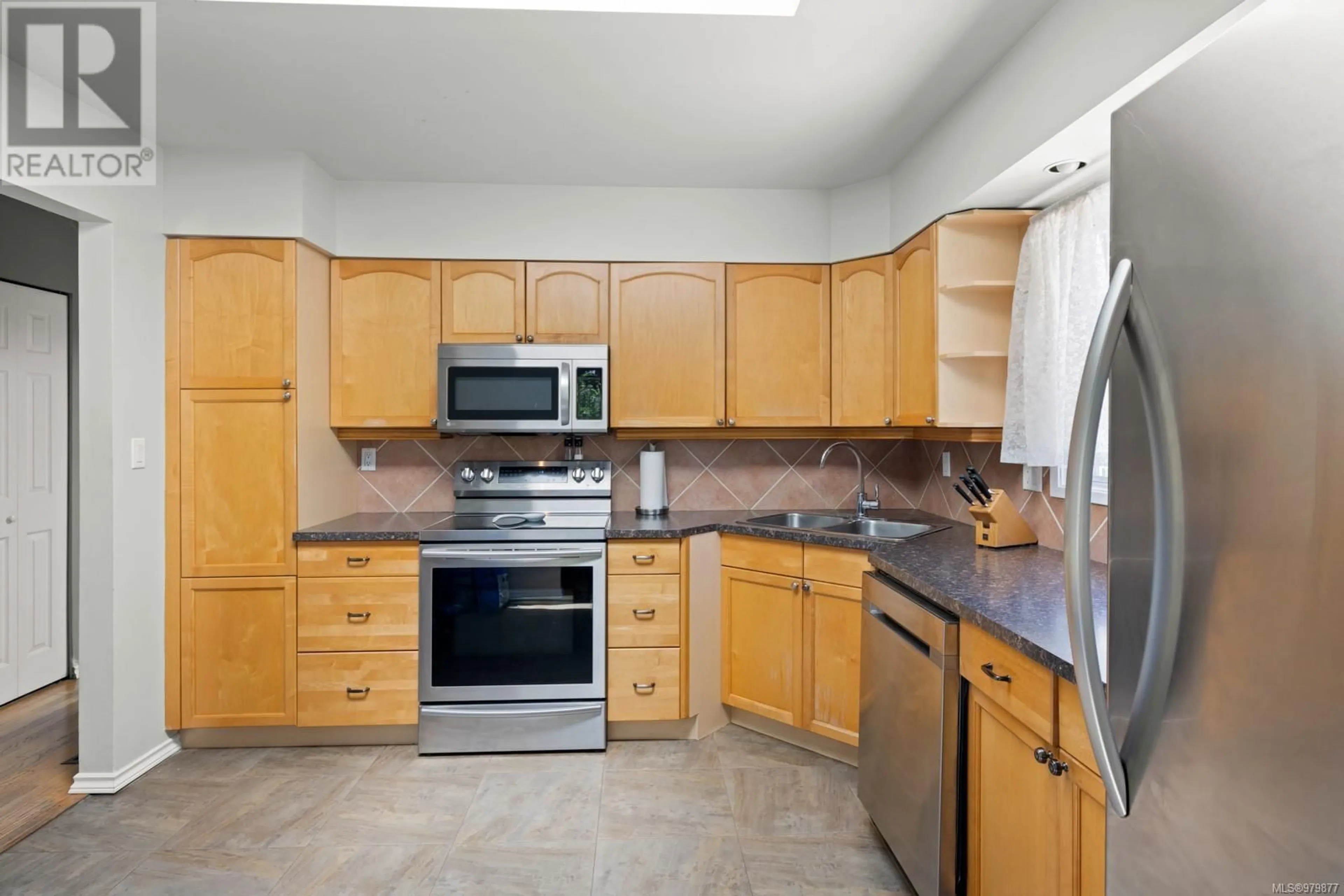 Standard kitchen, wood floors, cottage for 3188 Glen Lake Rd, Langford British Columbia V9B4B7