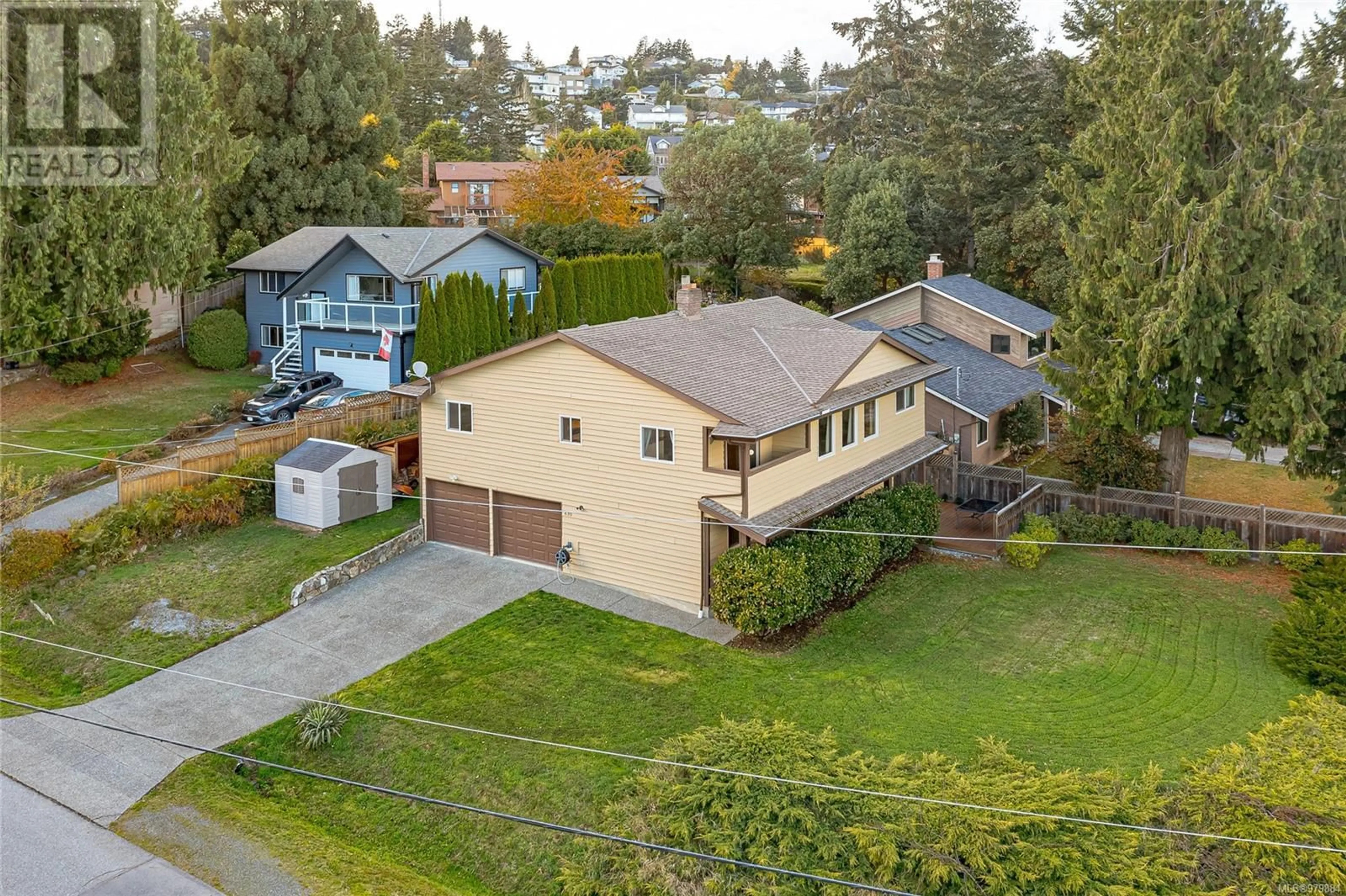 Frontside or backside of a home, the fenced backyard for 630 Hope Rd, Colwood British Columbia V9C3L8