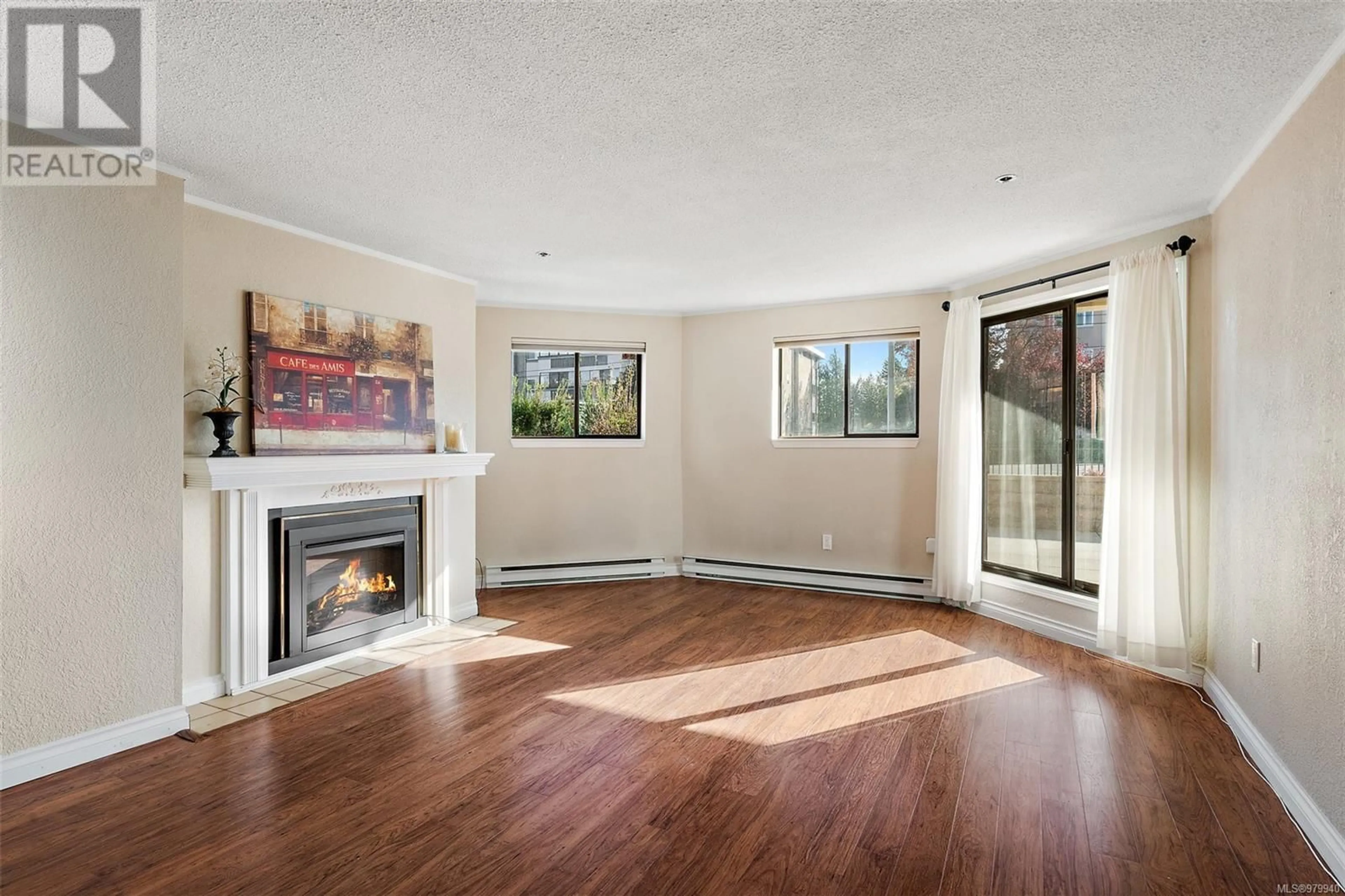 Living room, wood floors for 105 1560 Hillside Ave, Victoria British Columbia V8T5B8