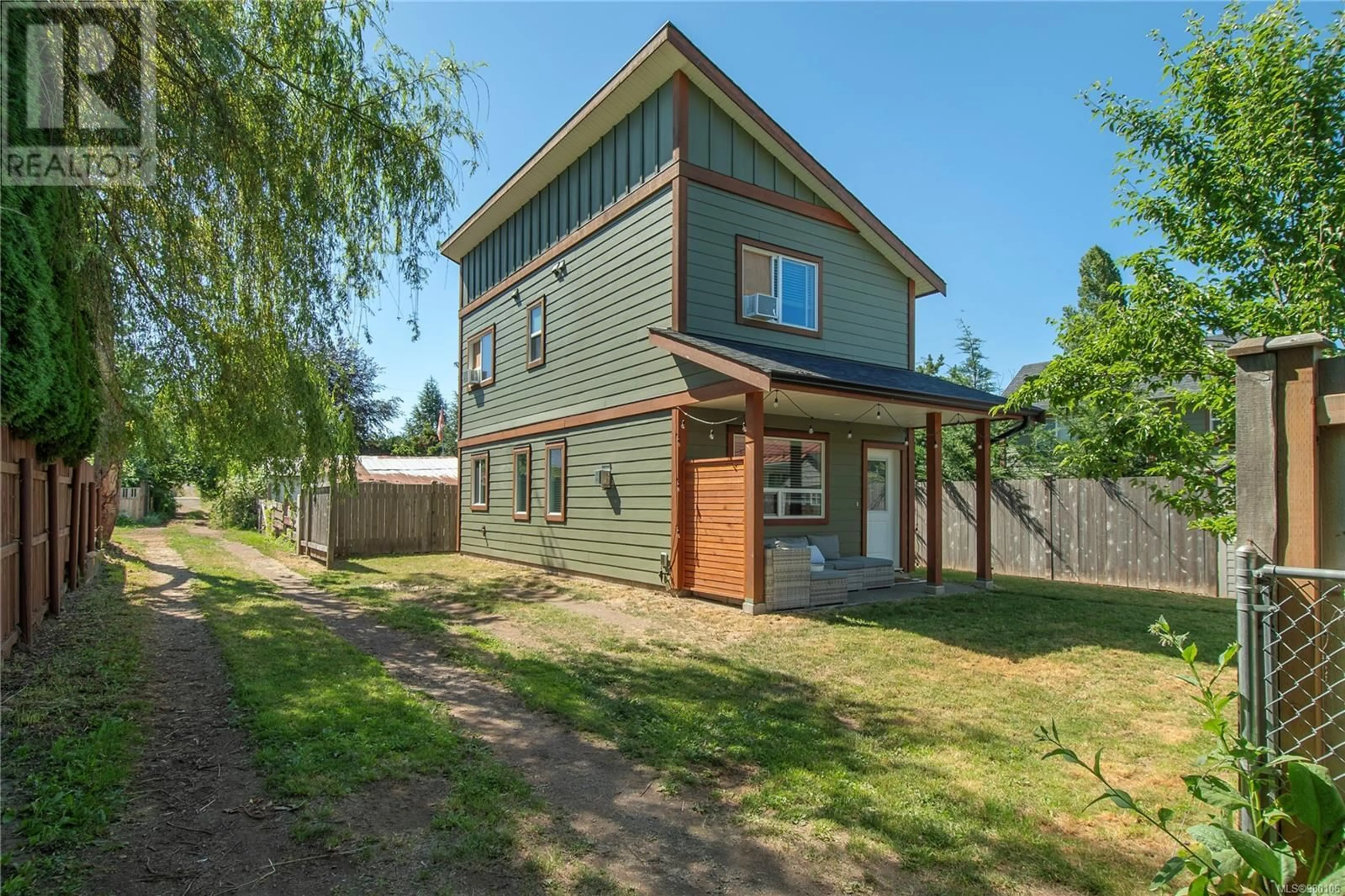 A pic from exterior of the house or condo, the fenced backyard for 2799 Derwent Ave, Cumberland British Columbia V0R1S0