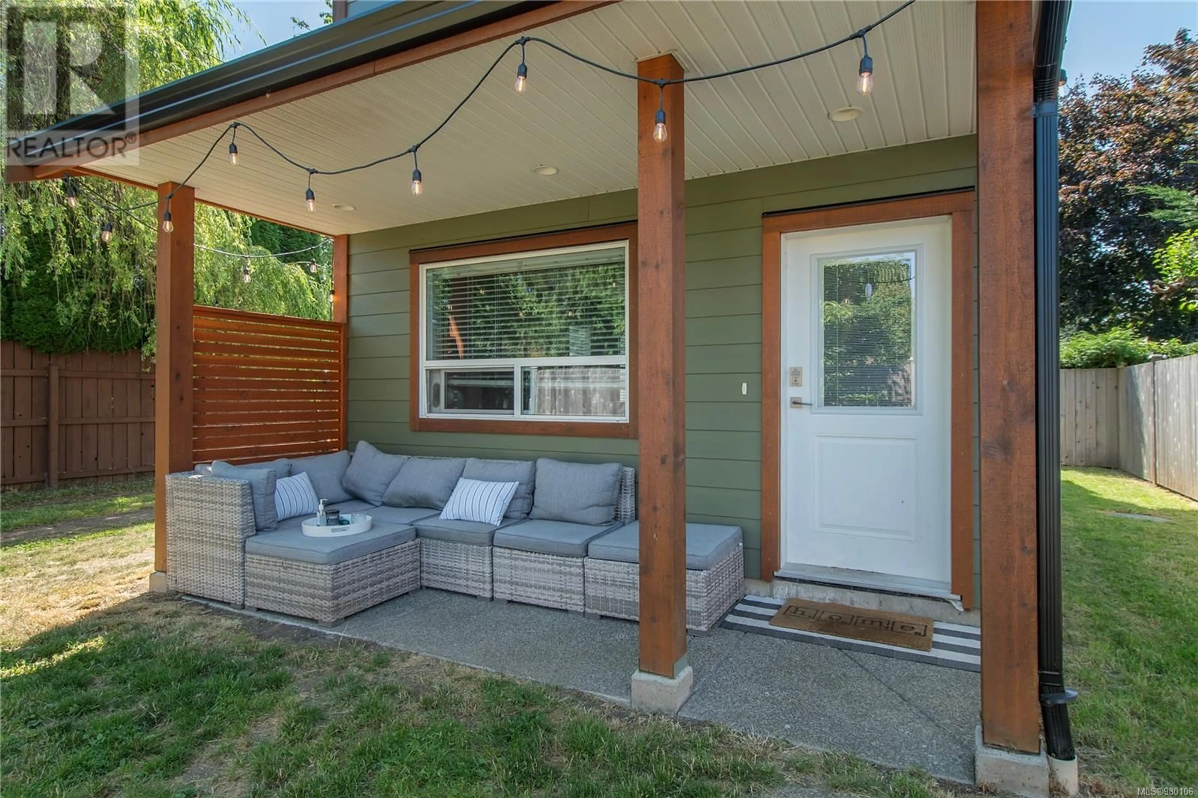 Patio, the fenced backyard for 2799 Derwent Ave, Cumberland British Columbia V0R1S0