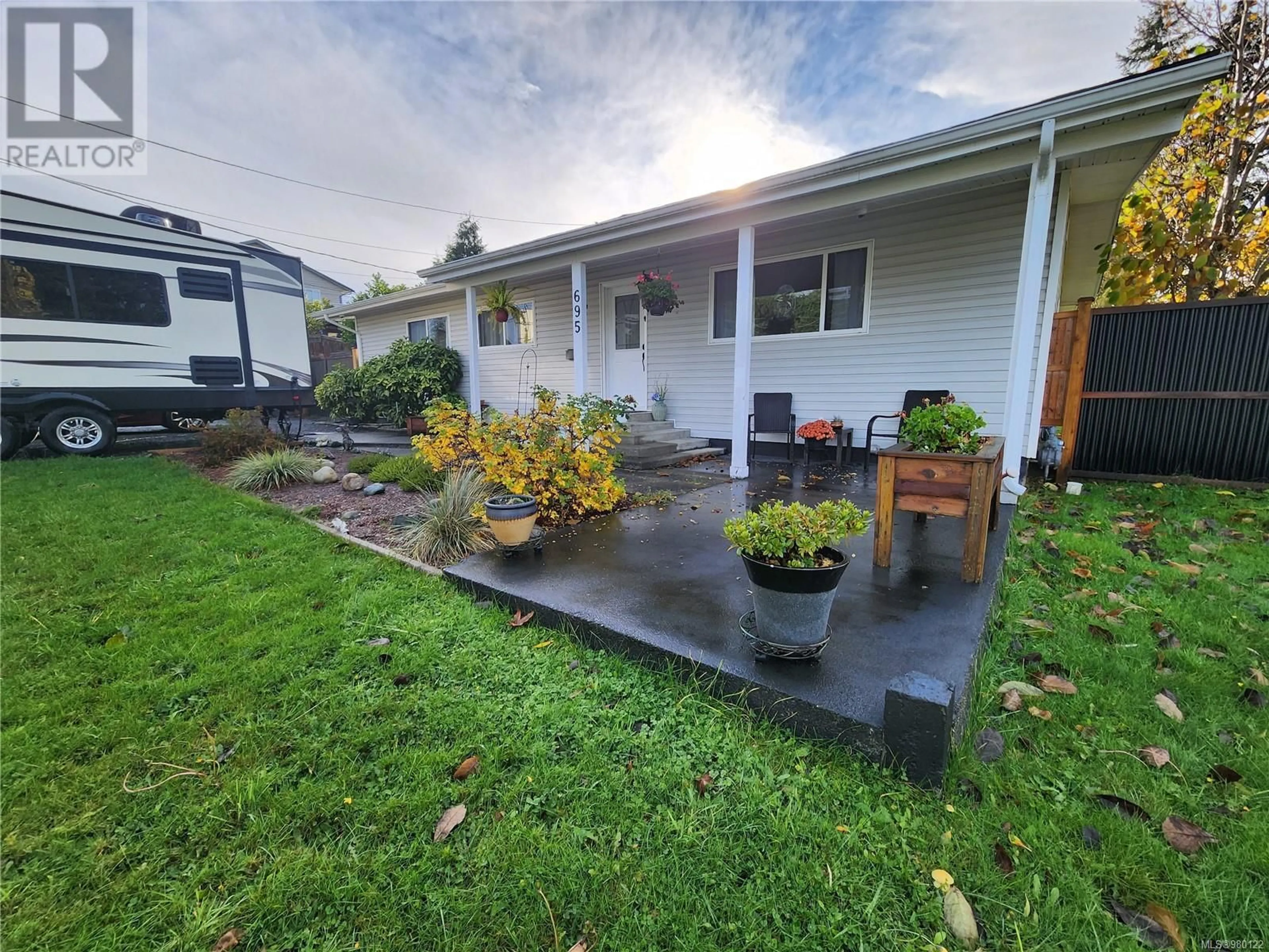 Frontside or backside of a home, the fenced backyard for 695 Evergreen Rd, Campbell River British Columbia V9W3R7