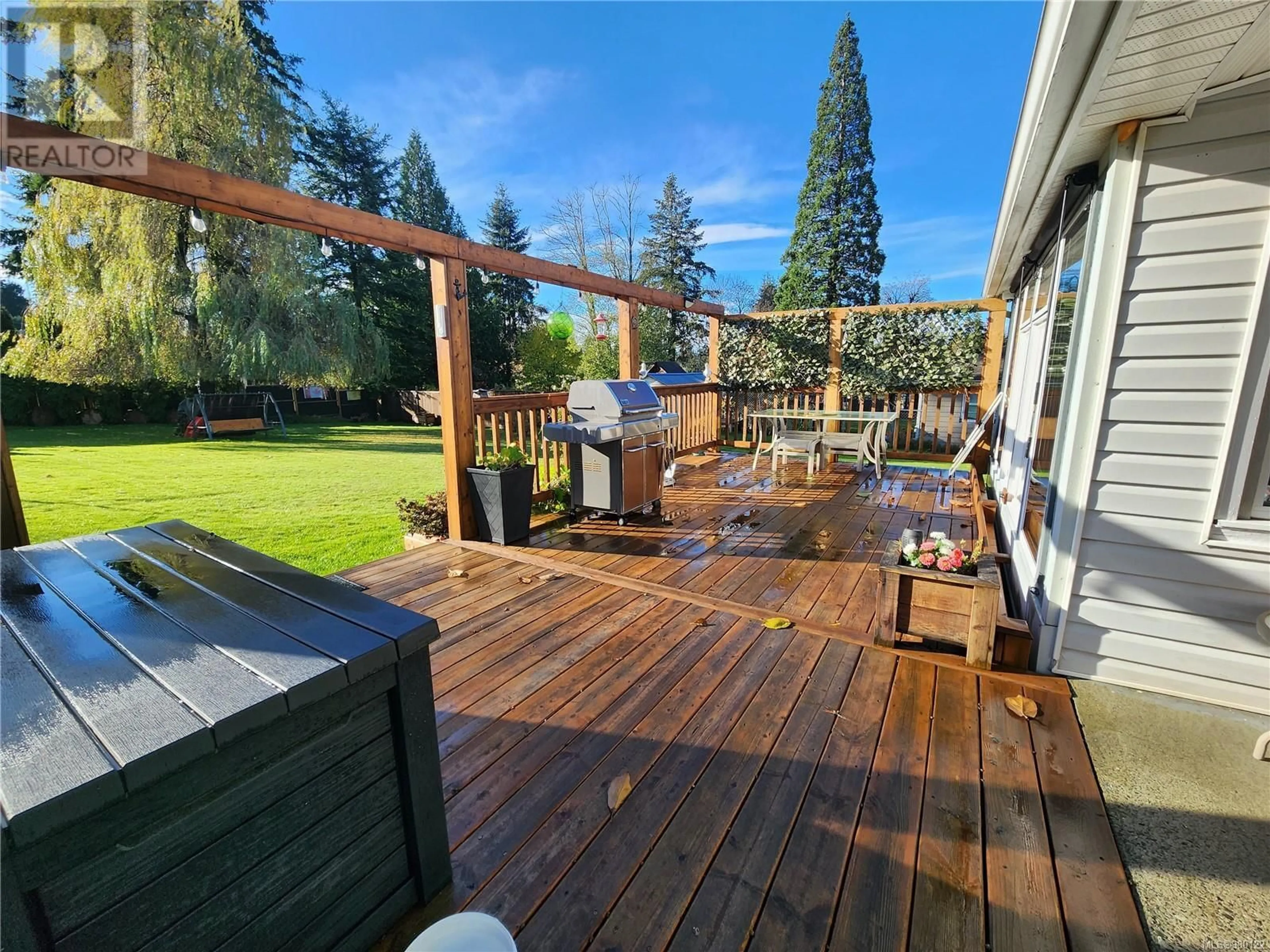 Patio, the fenced backyard for 695 Evergreen Rd, Campbell River British Columbia V9W3R7