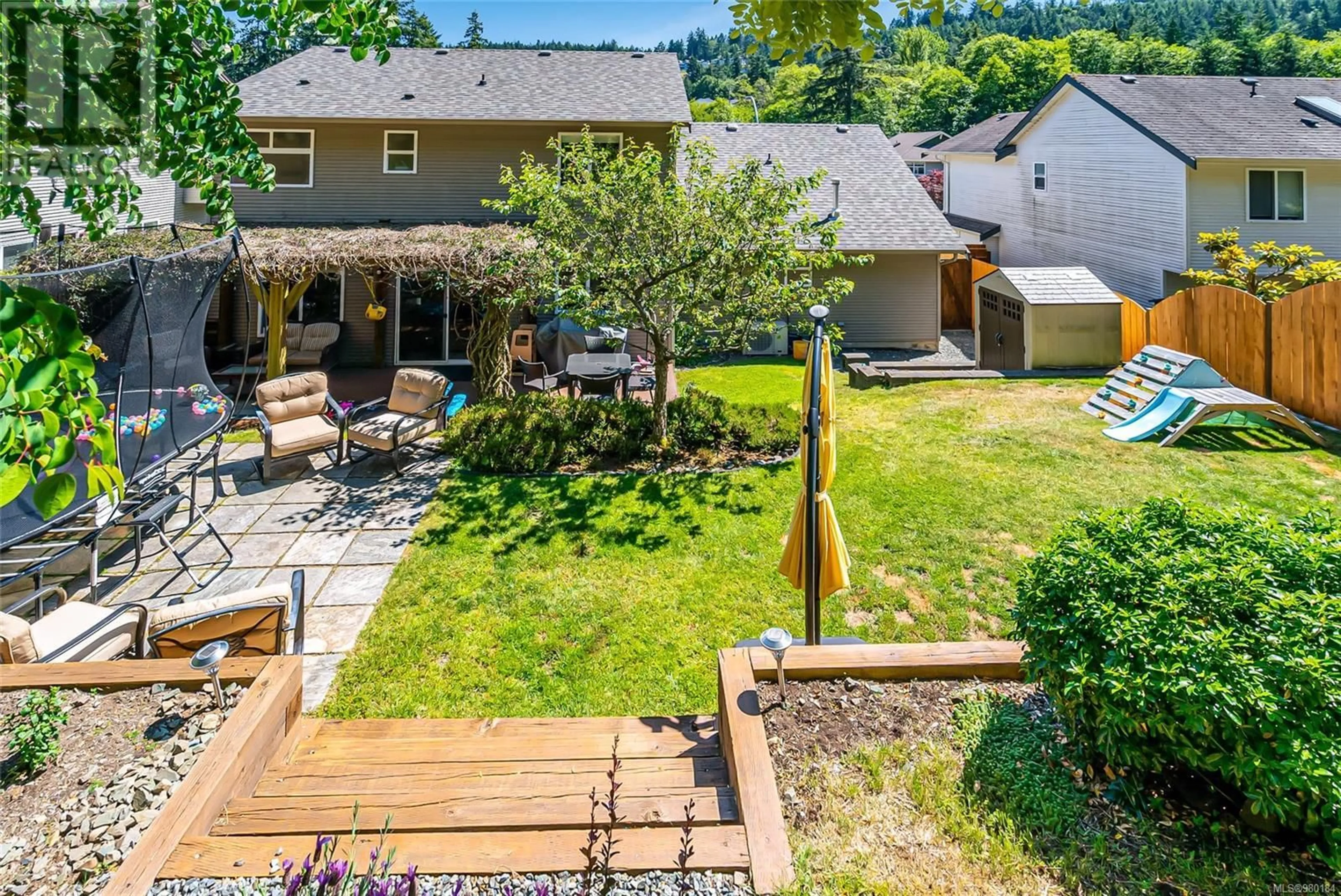 Patio, the fenced backyard for 4930 Hartwig Cres, Nanaimo British Columbia V9V1R2