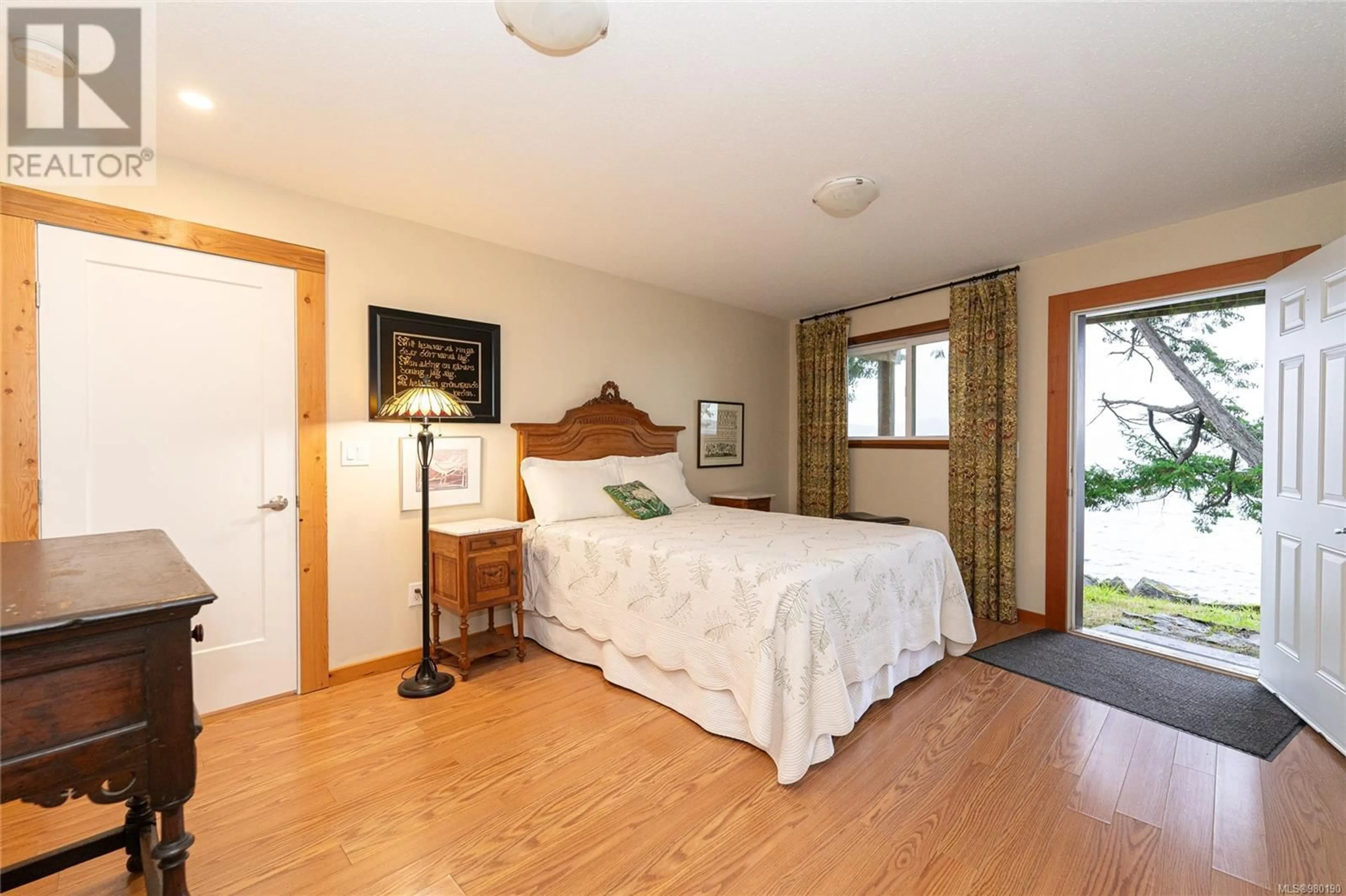 Bedroom with bed, wood/laminate floor for 198 PILKEY POINT ROAD, Thetis Island British Columbia V0R2Y0