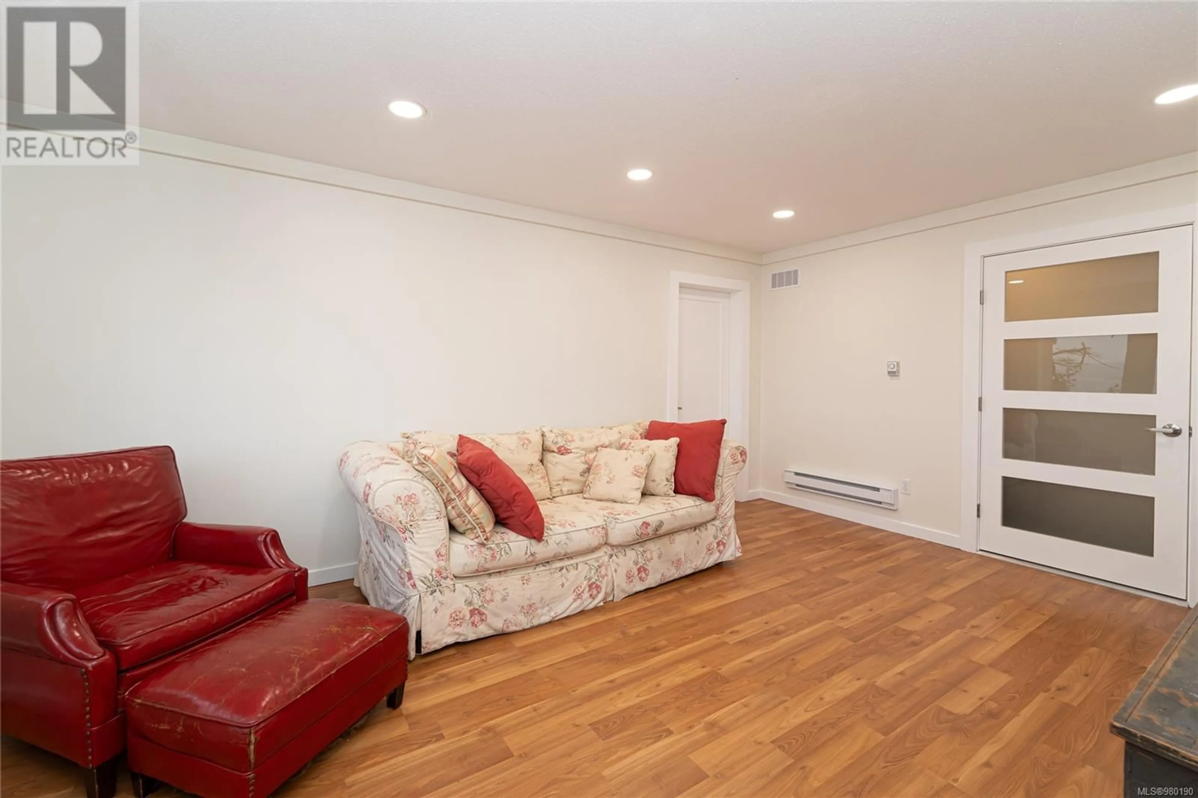 Living room with furniture, wood/laminate floor for 198 PILKEY POINT ROAD, Thetis Island British Columbia V0R2Y0