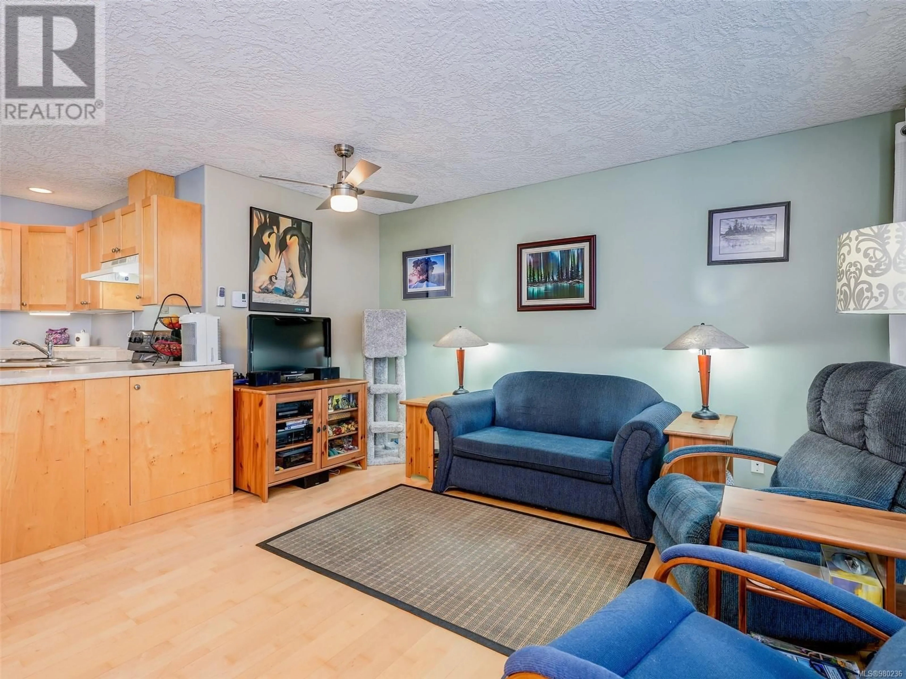 Living room, wood floors for 102 2844 Bryn Maur Rd, Langford British Columbia V9B3T4