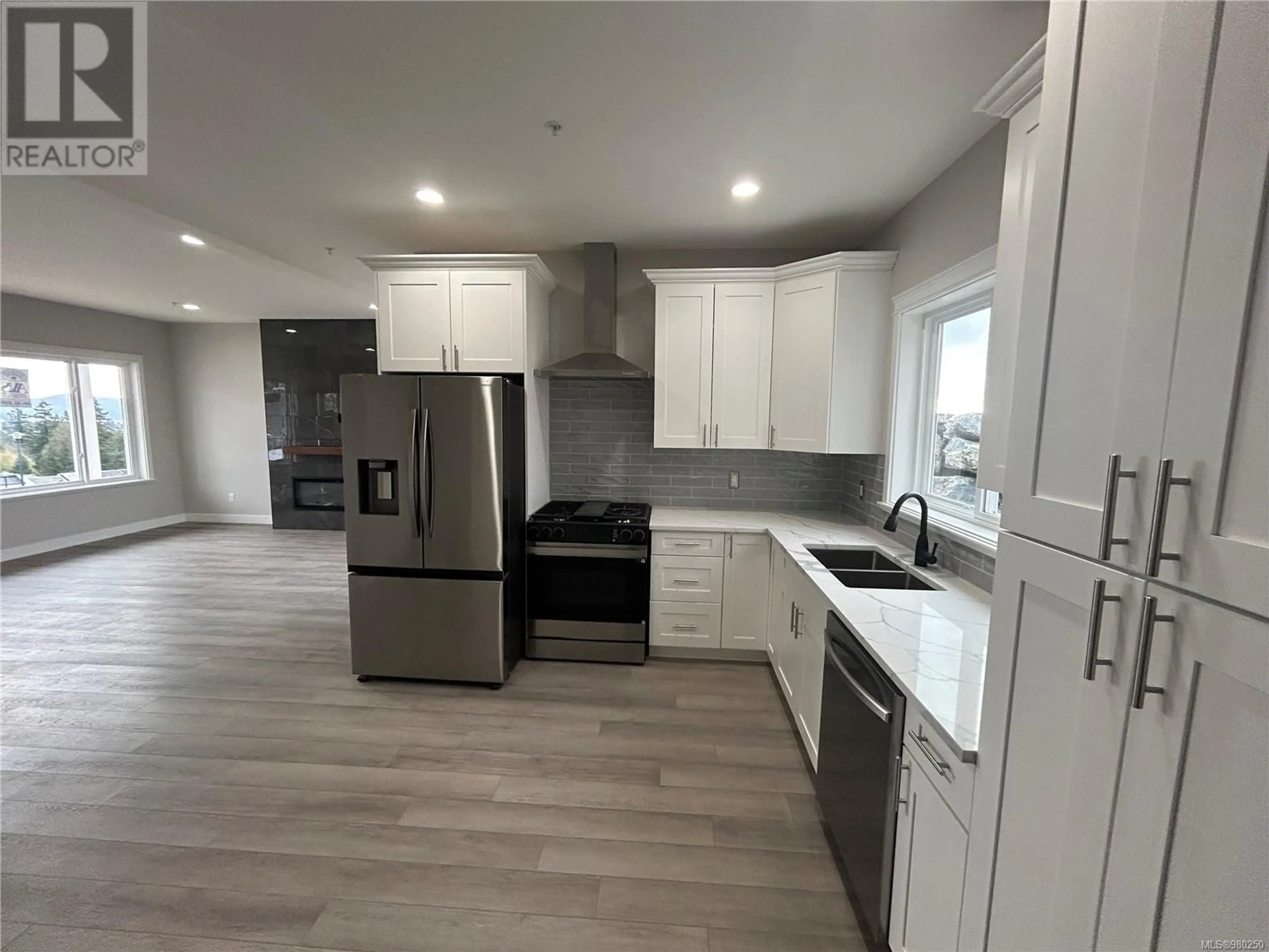 Open concept kitchen for 7061 Brailsford Pl, Sooke British Columbia V9Z1R2