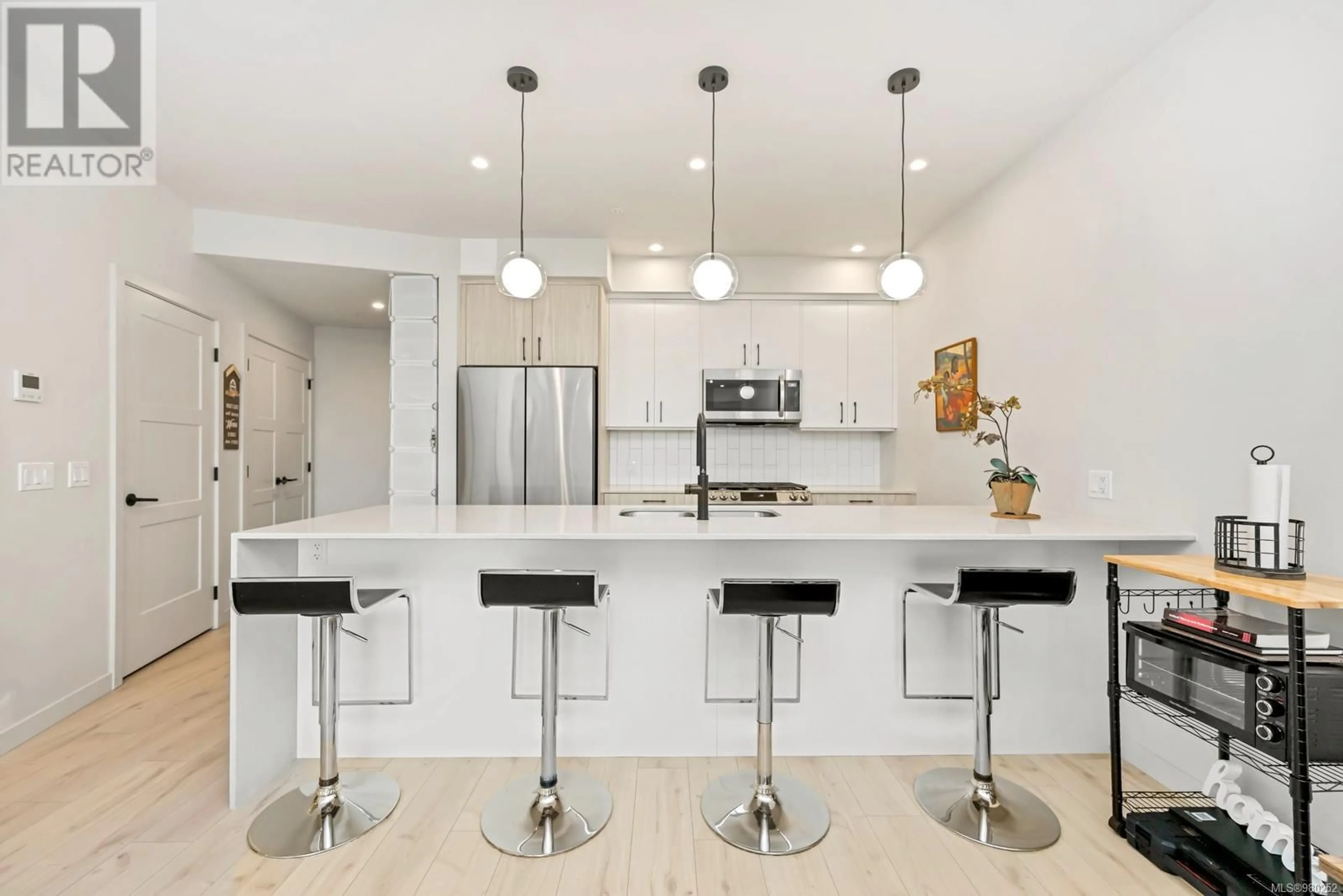 Contemporary kitchen, wood floors for 409 958 Pharoah Mews, Langford British Columbia V9B7A1