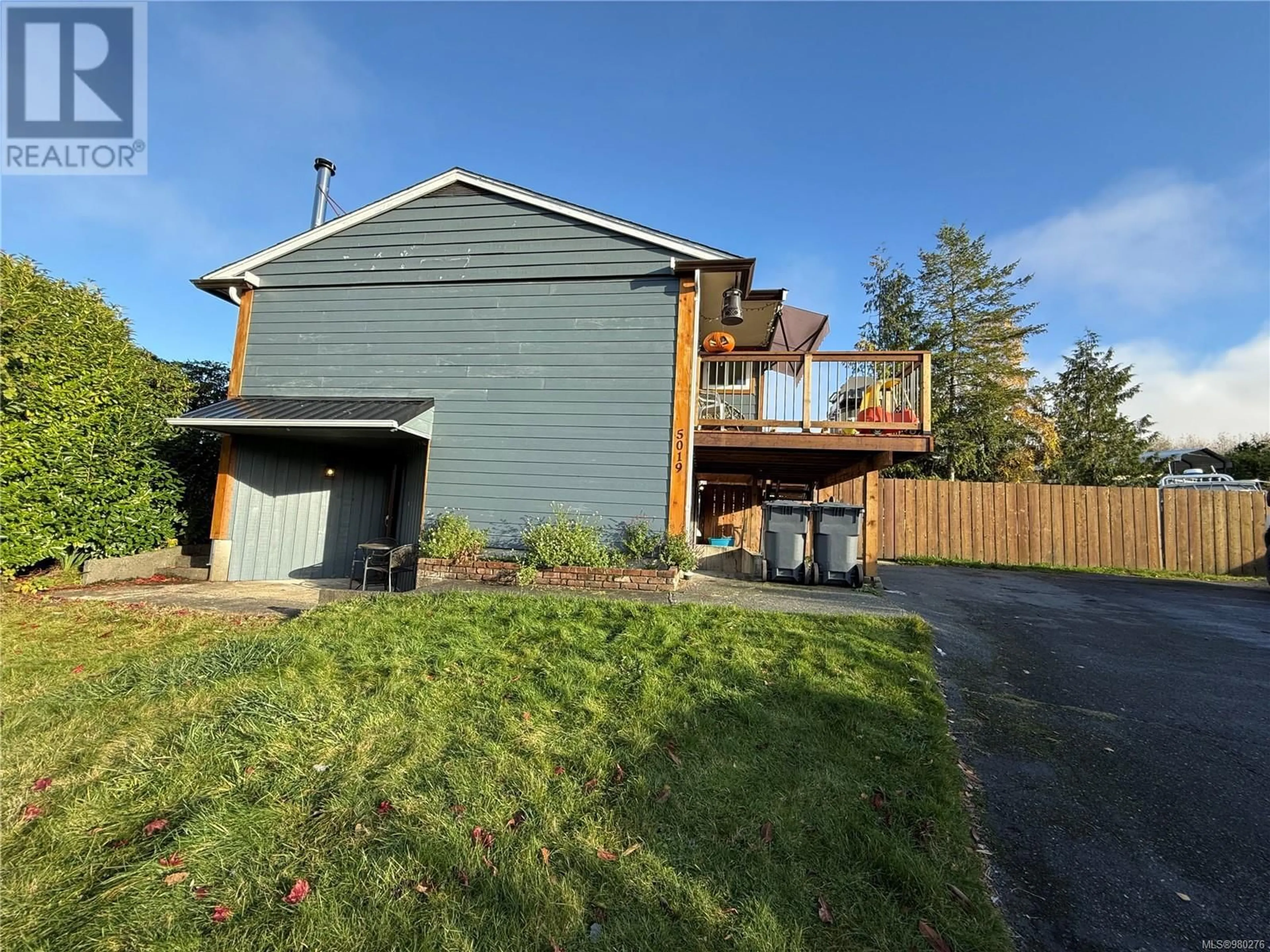 Frontside or backside of a home, the fenced backyard for 5019 Peel Pl, Port Hardy British Columbia V0N2P0