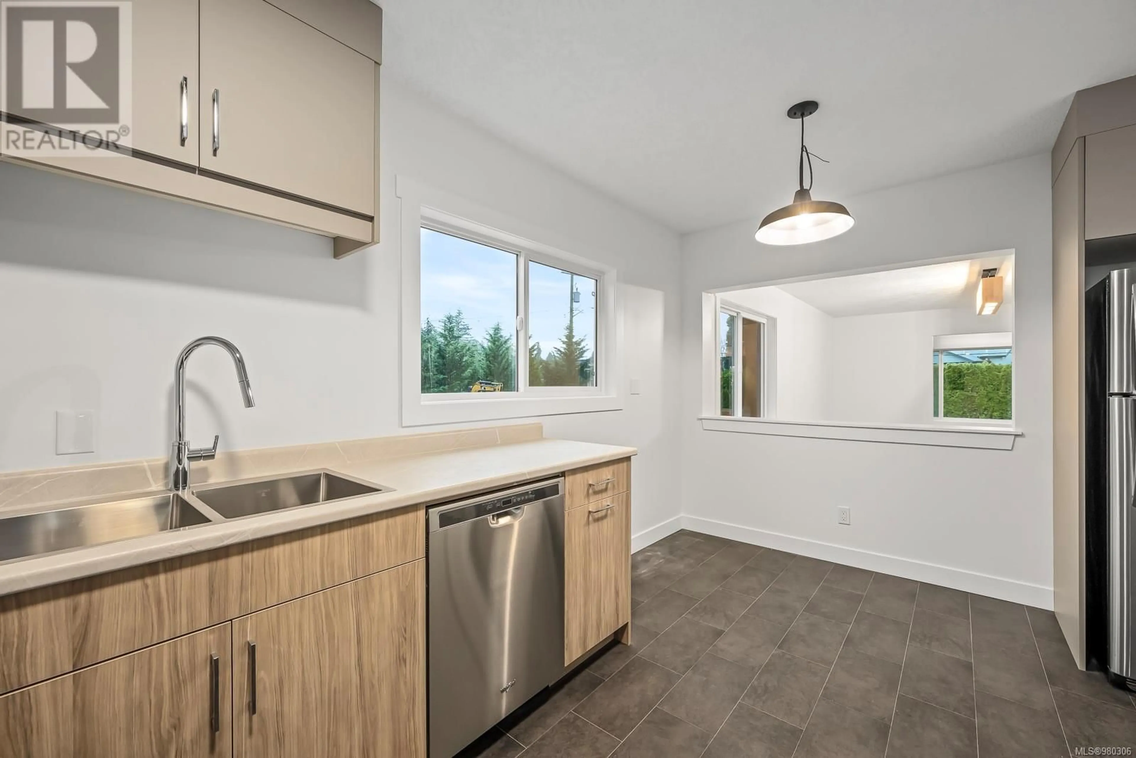 Open concept kitchen for SL3 4703 Cumberland Rd, Cumberland British Columbia V0R1S0