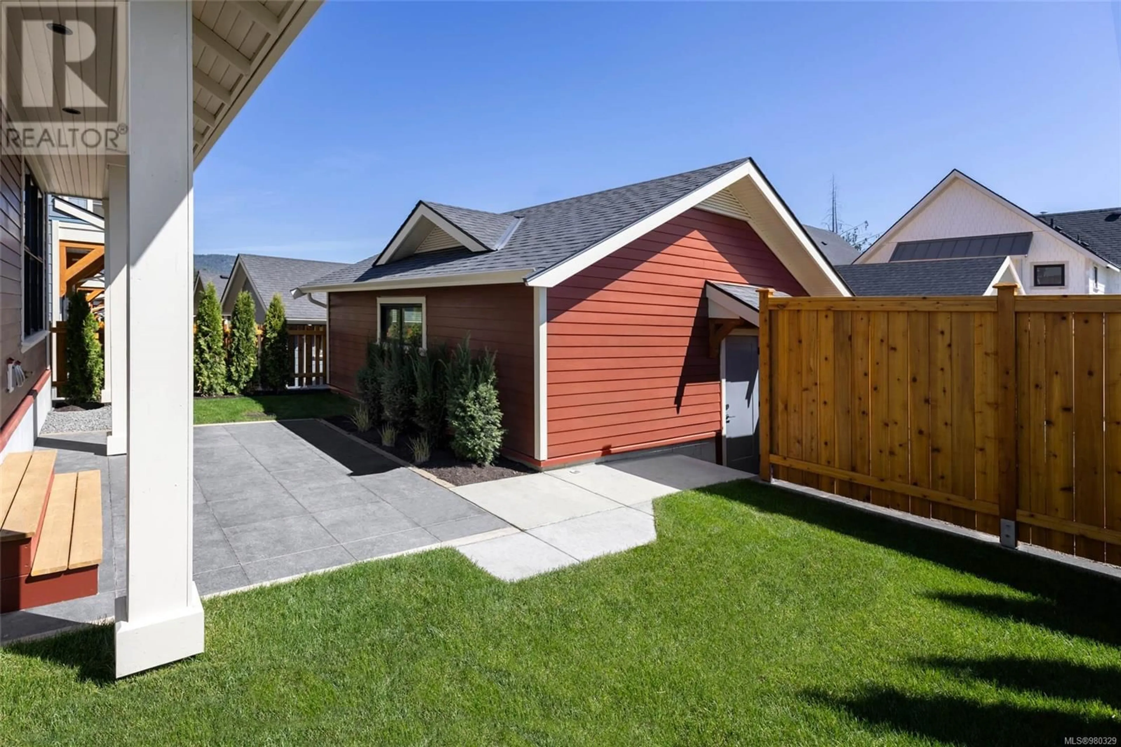 Frontside or backside of a home, the fenced backyard for 2179 Porcini Grove, Sooke British Columbia V9Z0W7