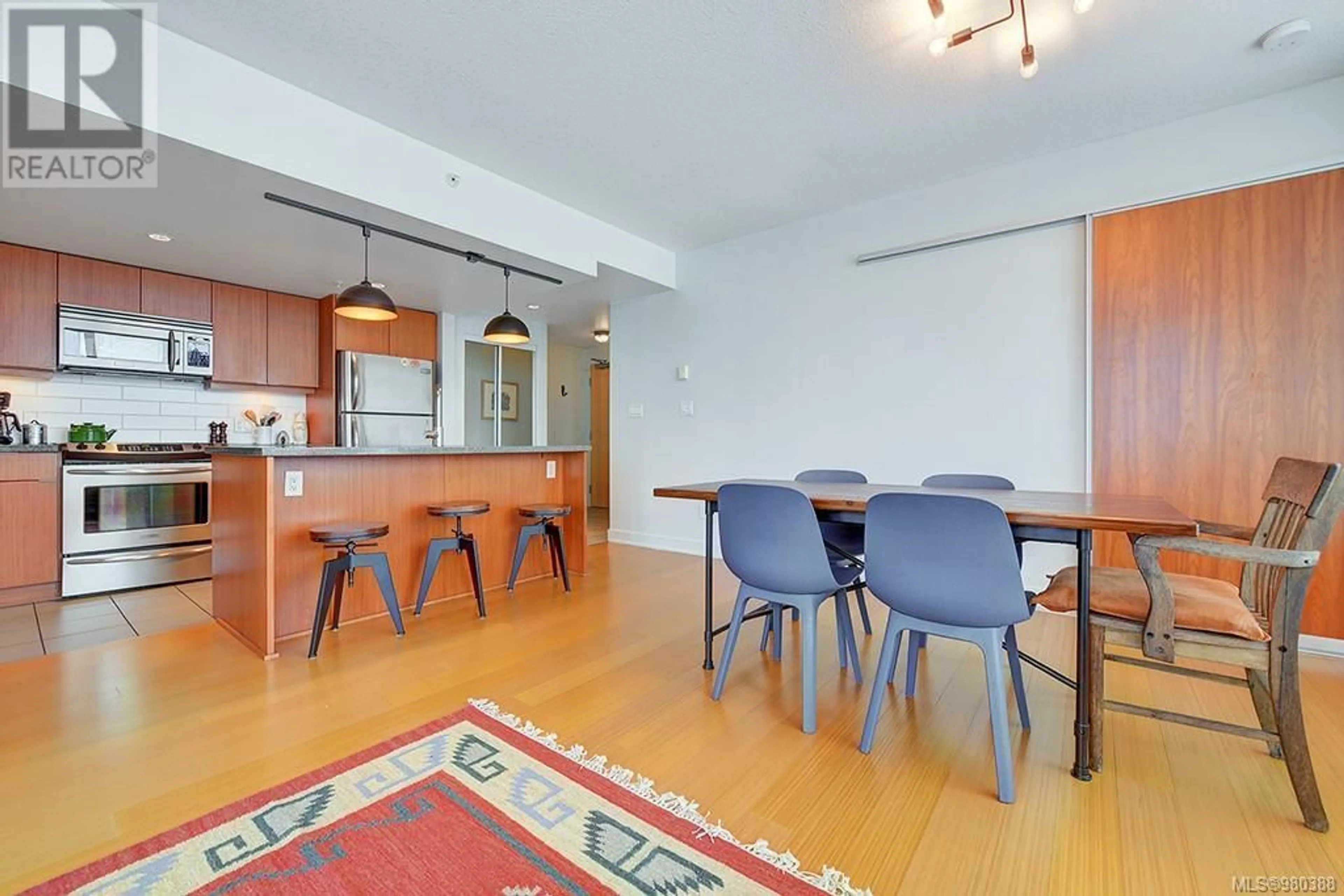 Dining room, wood floors for 504 760 Johnson St, Victoria British Columbia V8W1N1