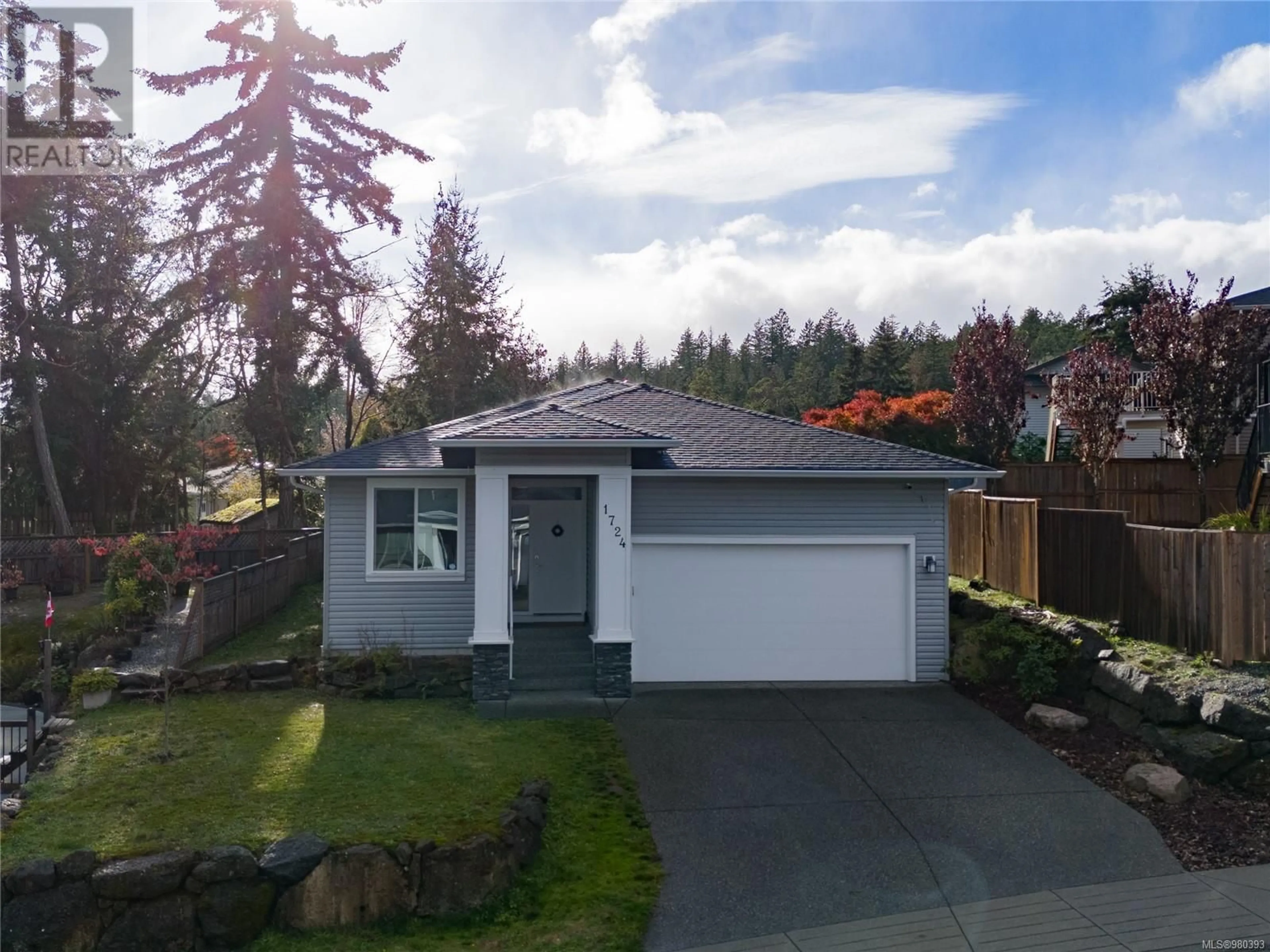 Frontside or backside of a home, the fenced backyard for 1724 Harambe Way, Nanaimo British Columbia V9X0B3