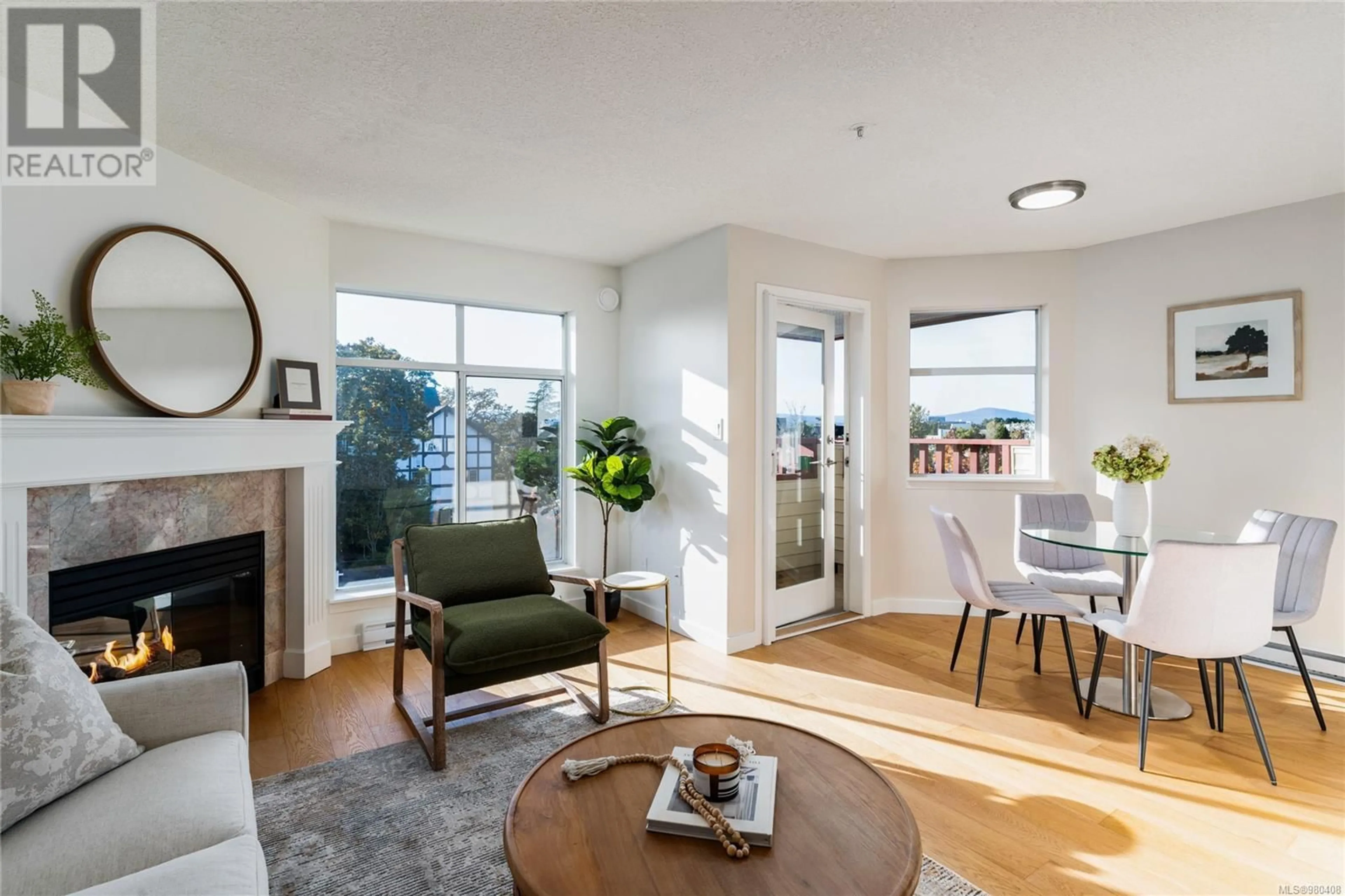 Living room, wood floors for 401 2511 Quadra St, Victoria British Columbia V8T4E1