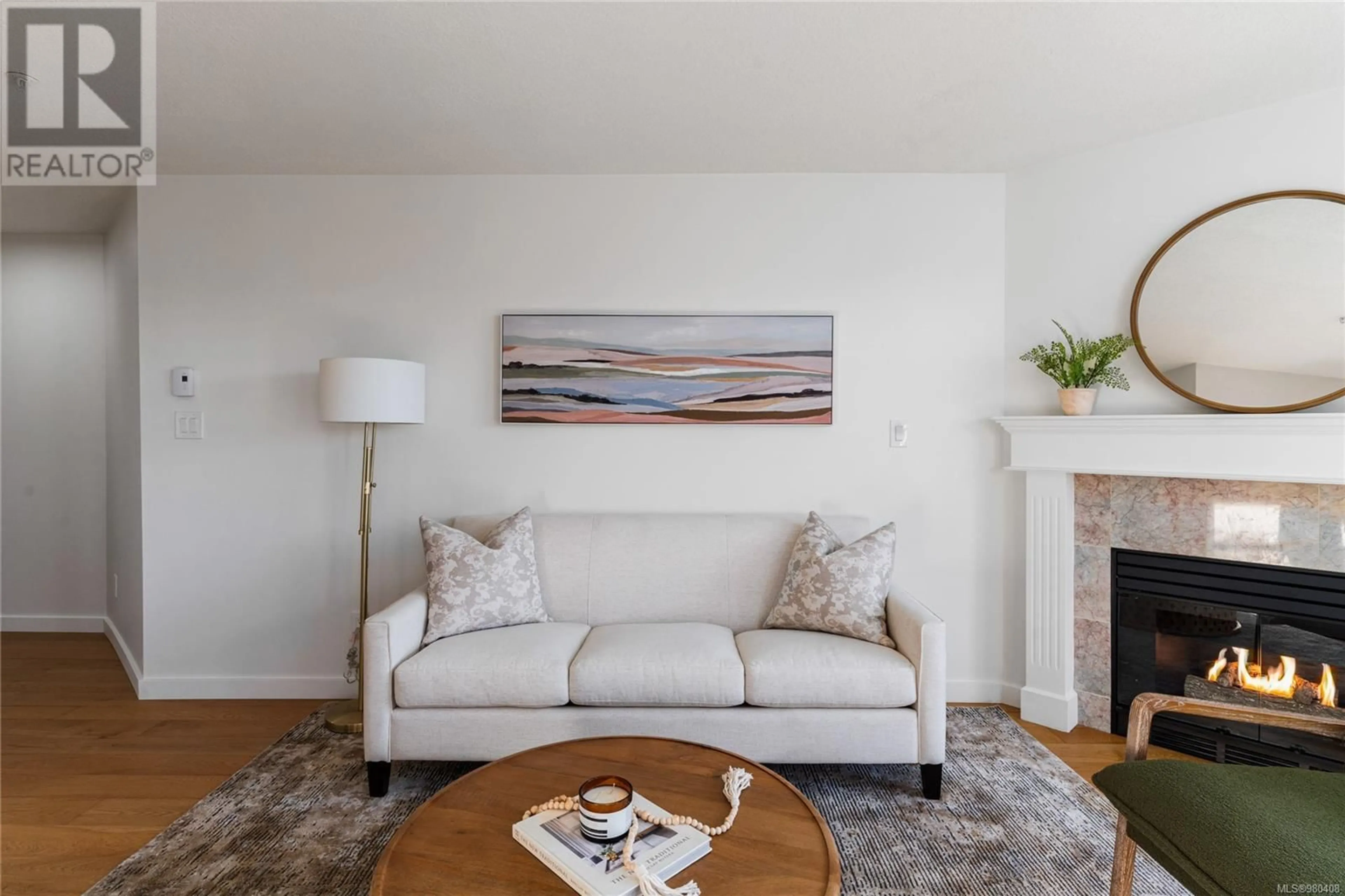 Living room, wood floors for 401 2511 Quadra St, Victoria British Columbia V8T4E1