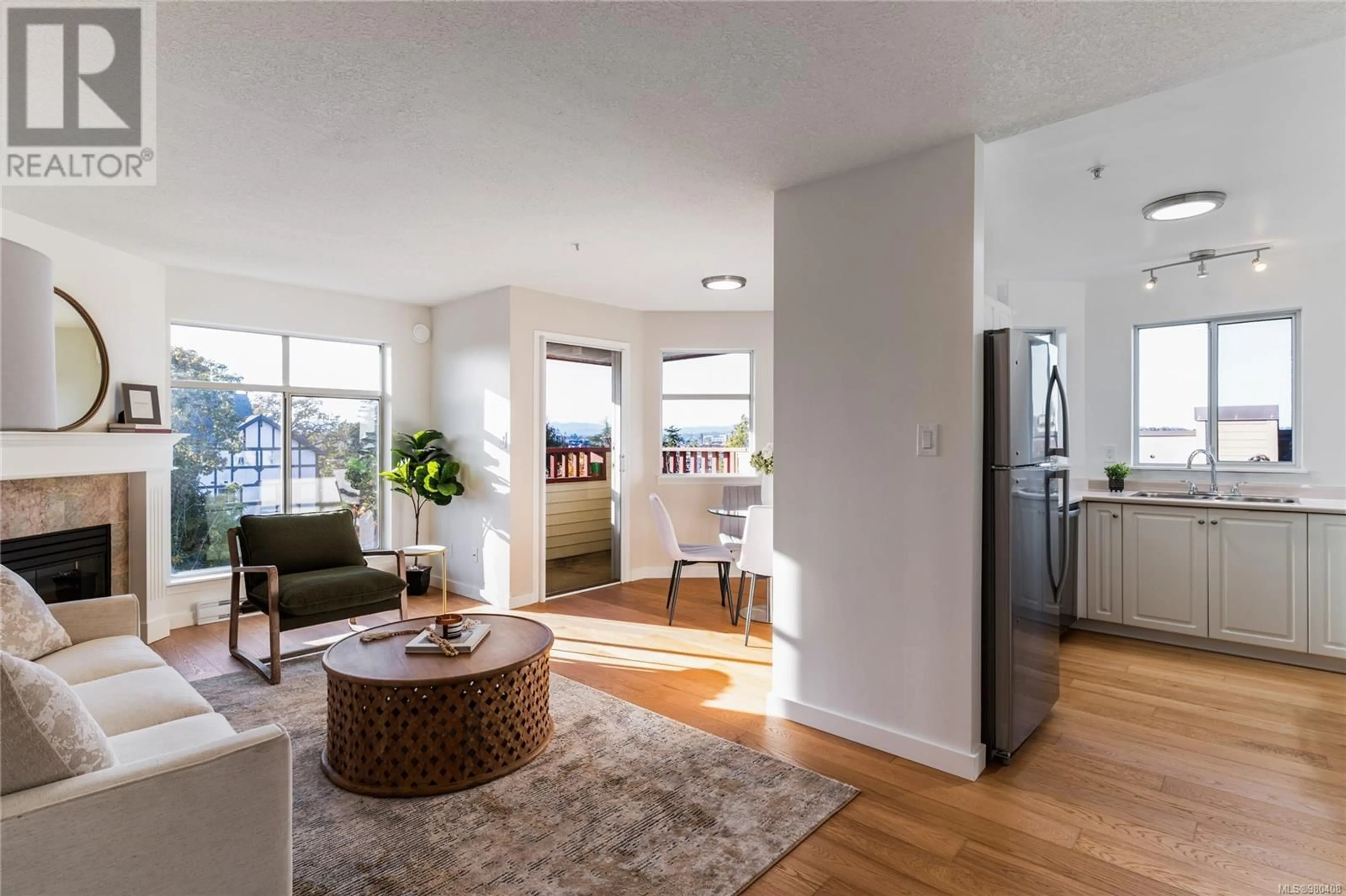 Living room, wood floors for 401 2511 Quadra St, Victoria British Columbia V8T4E1