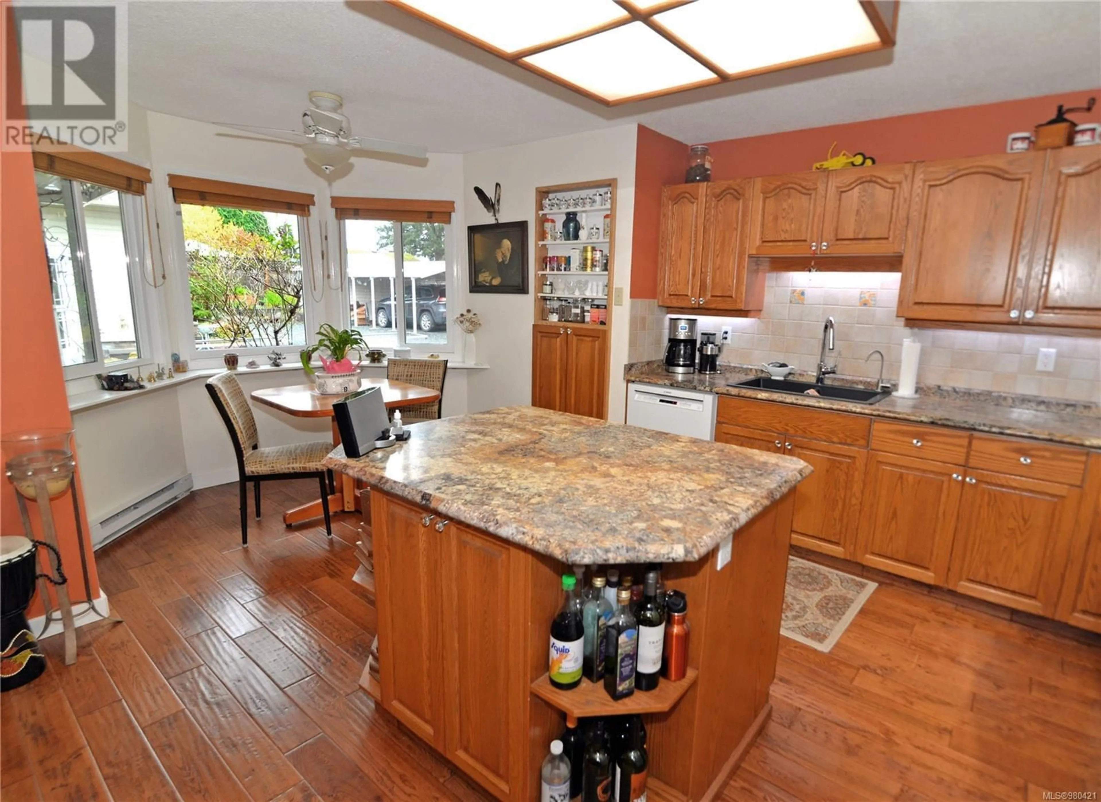 Open concept kitchen for 576 Dogwood Rd, Qualicum Beach British Columbia V9K1B1