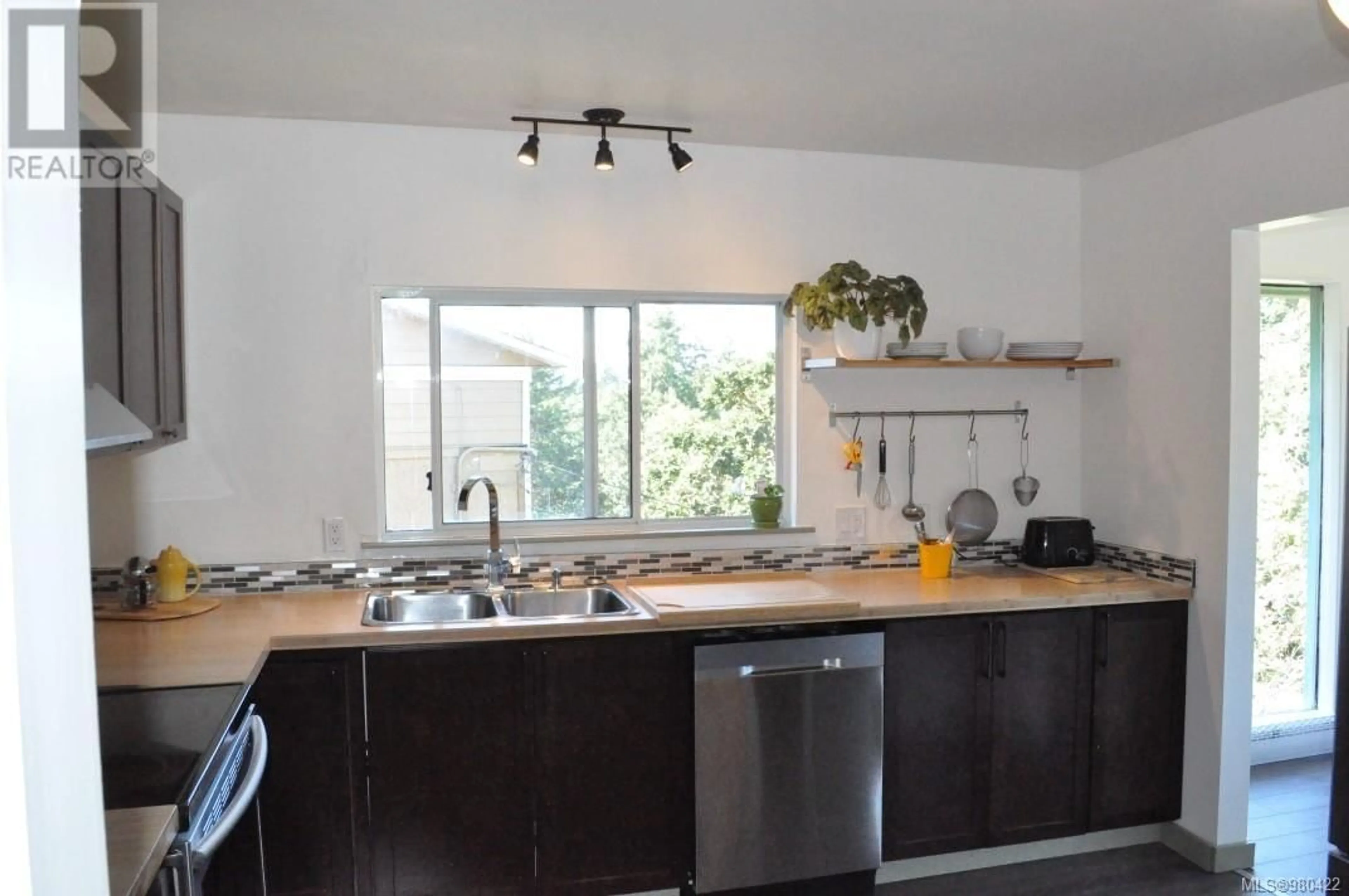 Standard kitchen, wood floors, cottage for 2641 Rainville Rd, Langford British Columbia V9B3N2