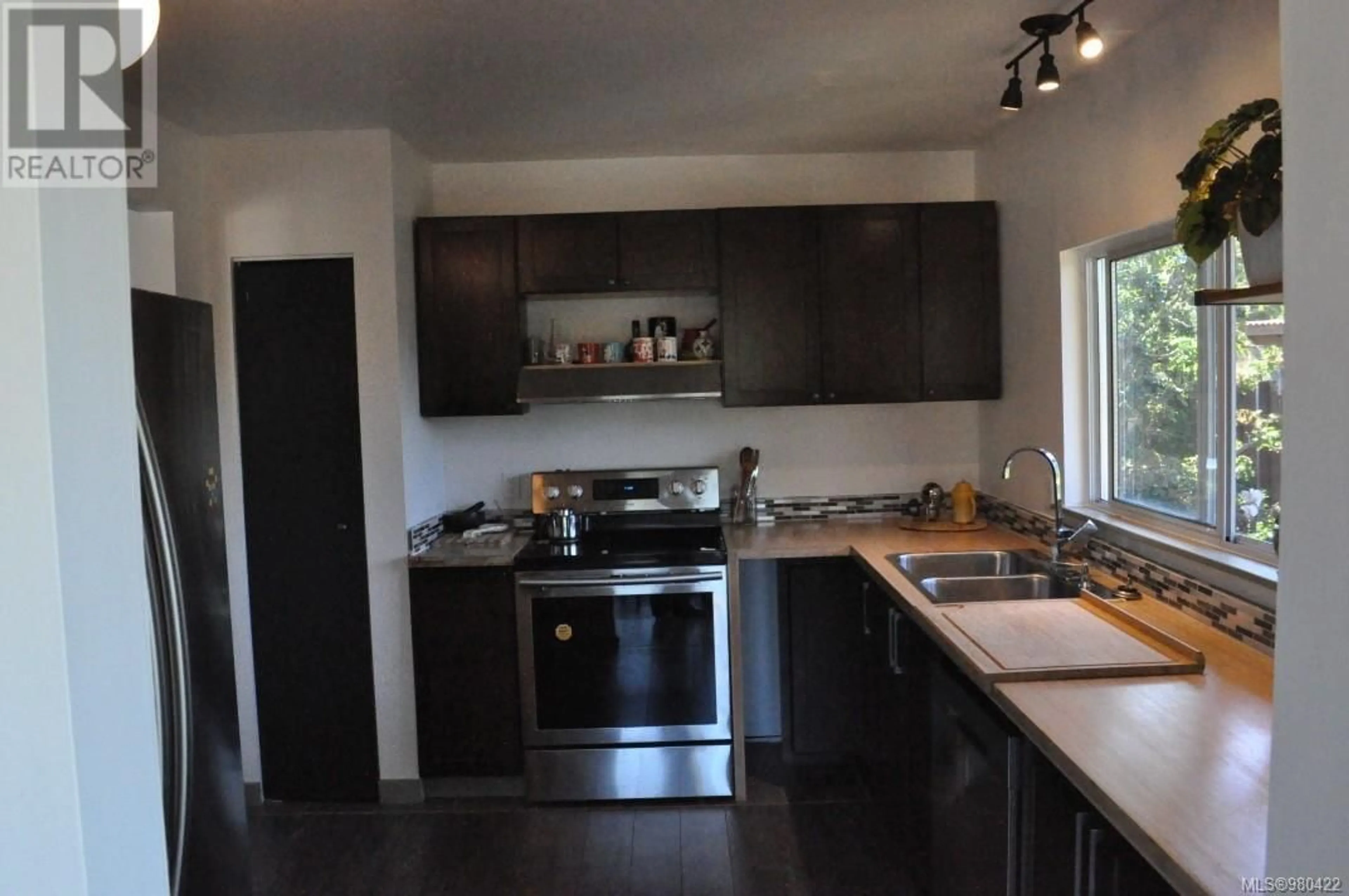 Standard kitchen, wood floors, cottage for 2641 Rainville Rd, Langford British Columbia V9B3N2