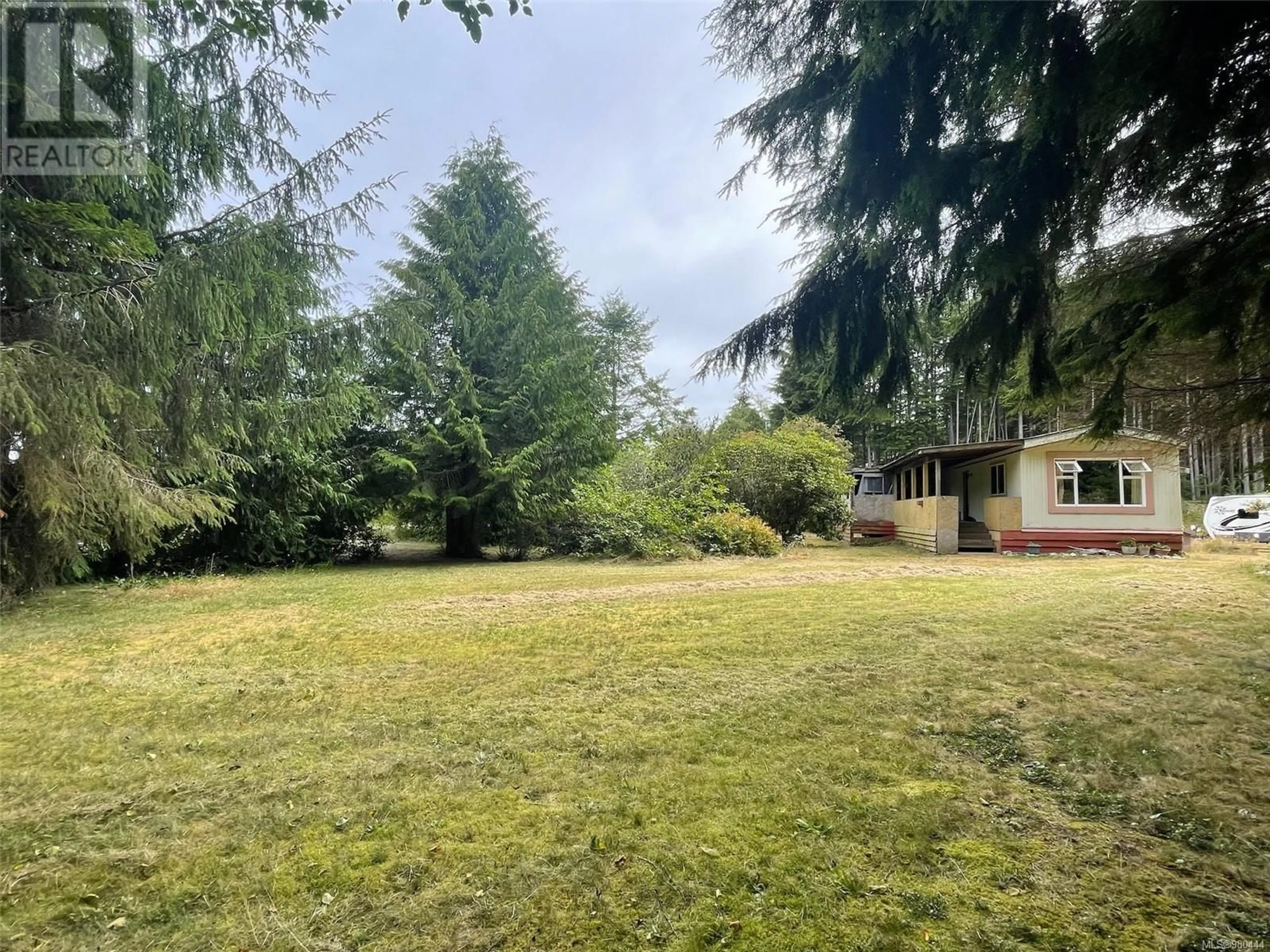 Frontside or backside of a home, the fenced backyard for 1007 Jekyll Rd, Hyde Creek British Columbia V0N2R0