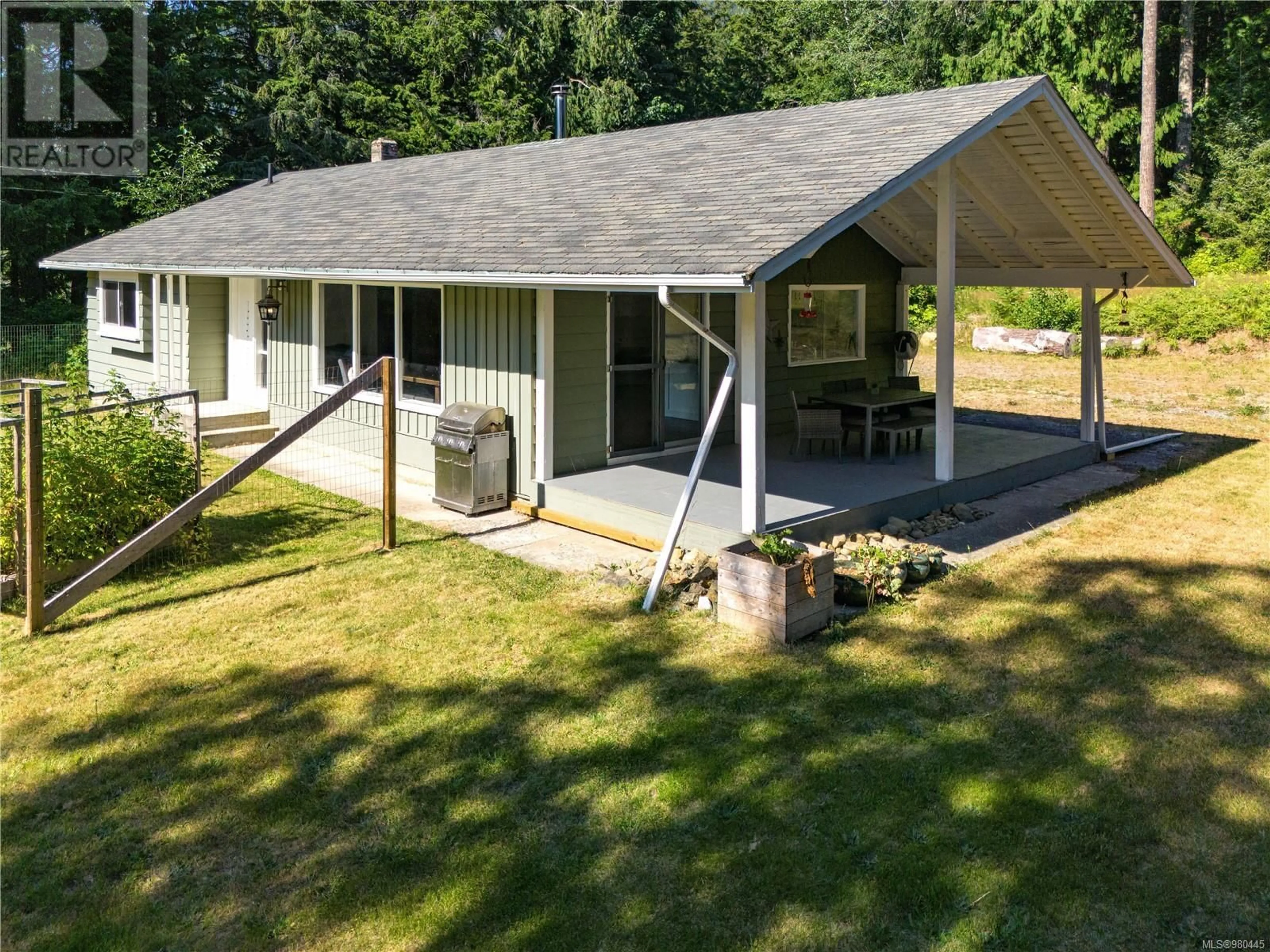 Home with vinyl exterior material for 1016 Sayward Rd, Sayward British Columbia V9W7Y8