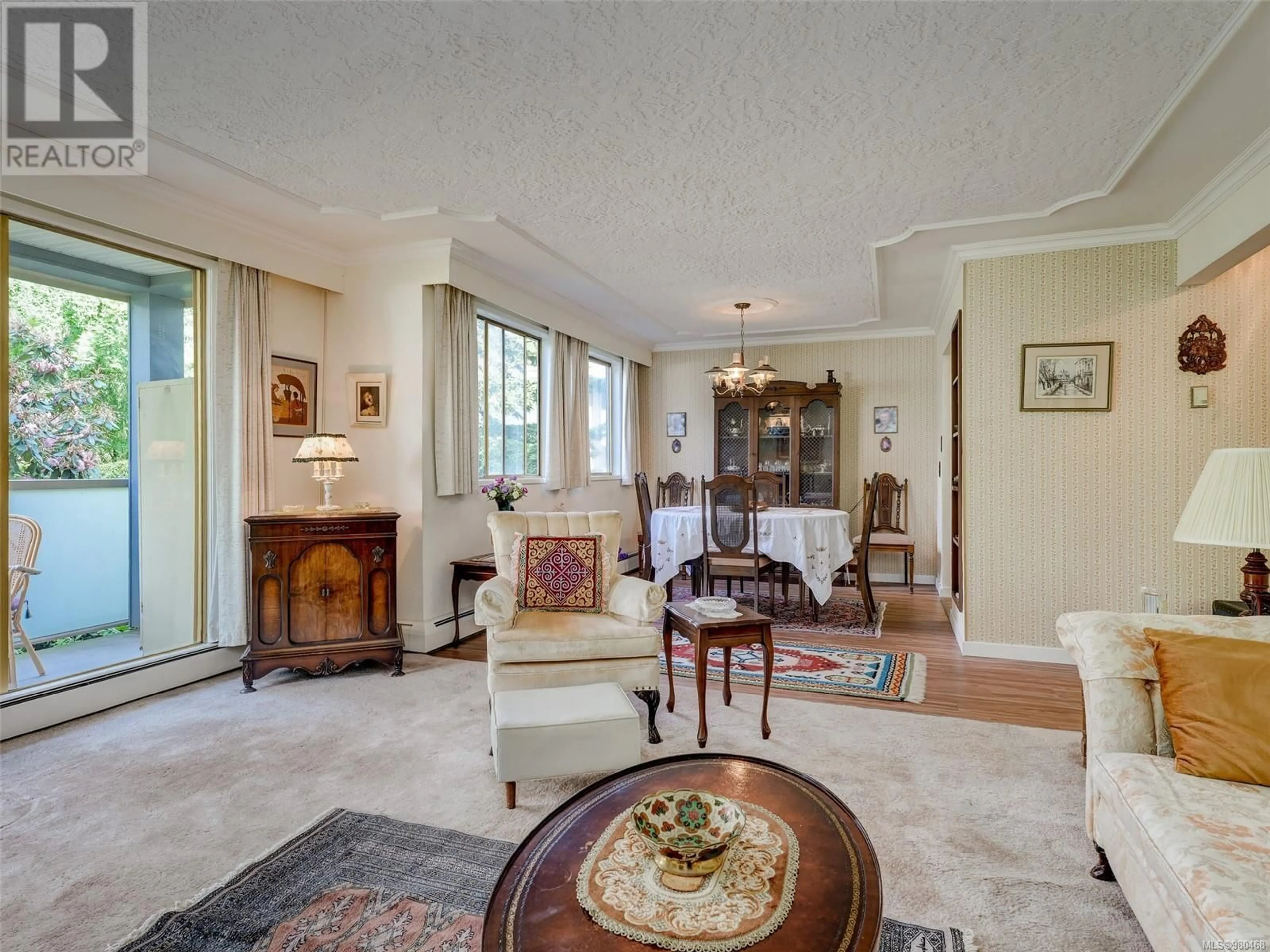 Living room, wood floors for 302 1025 Inverness Rd, Saanich British Columbia V8X2S2