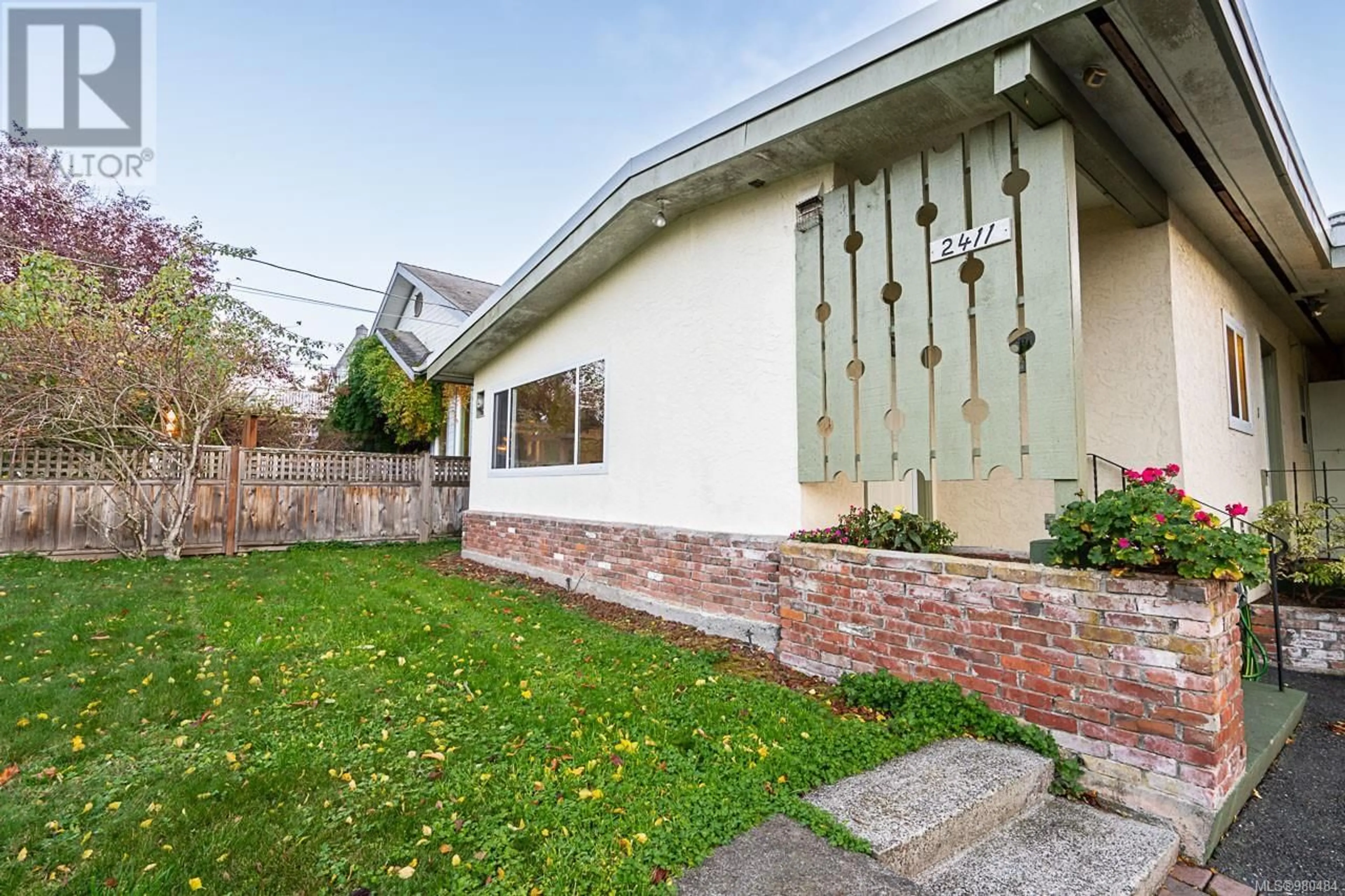 Frontside or backside of a home, the fenced backyard for 2411 Amelia Ave, Sidney British Columbia V8L2J4