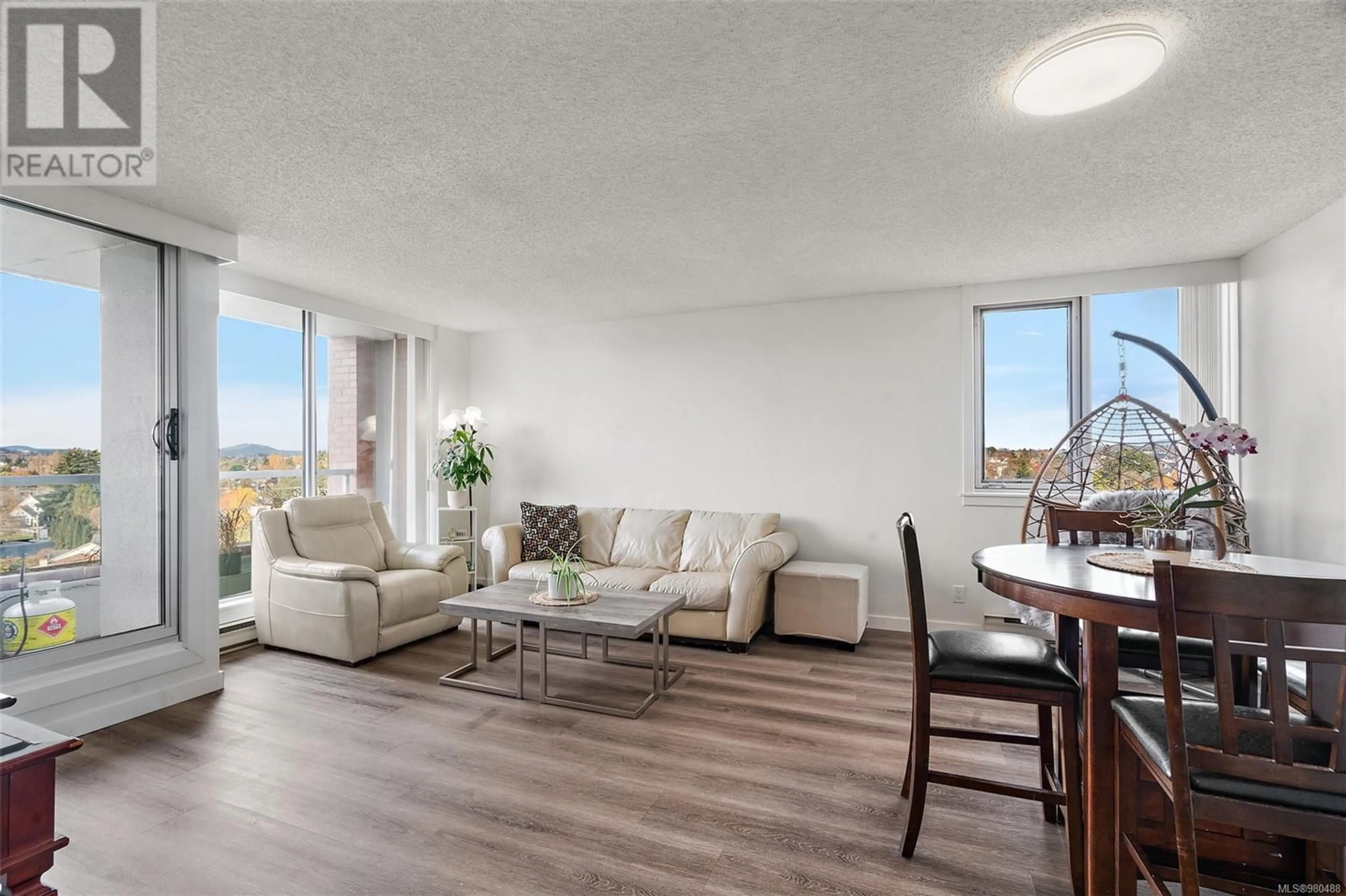 Living room with furniture, wood/laminate floor for 1101 - 327 MAITLAND STREET, Victoria British Columbia V9A7G7