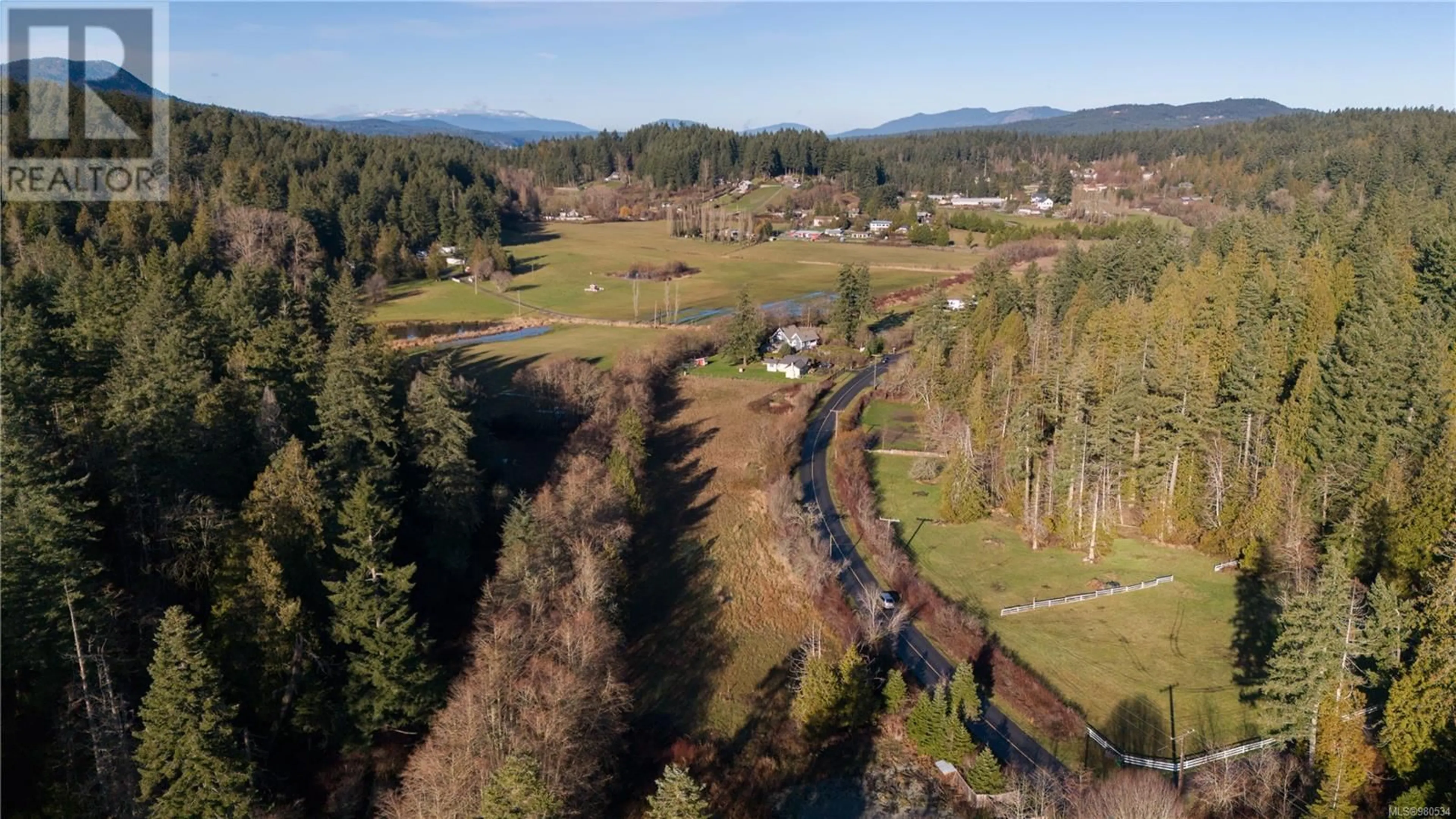 A pic from exterior of the house or condo, the fenced backyard for 5920 Wallace Dr, Saanich British Columbia V9E2G7