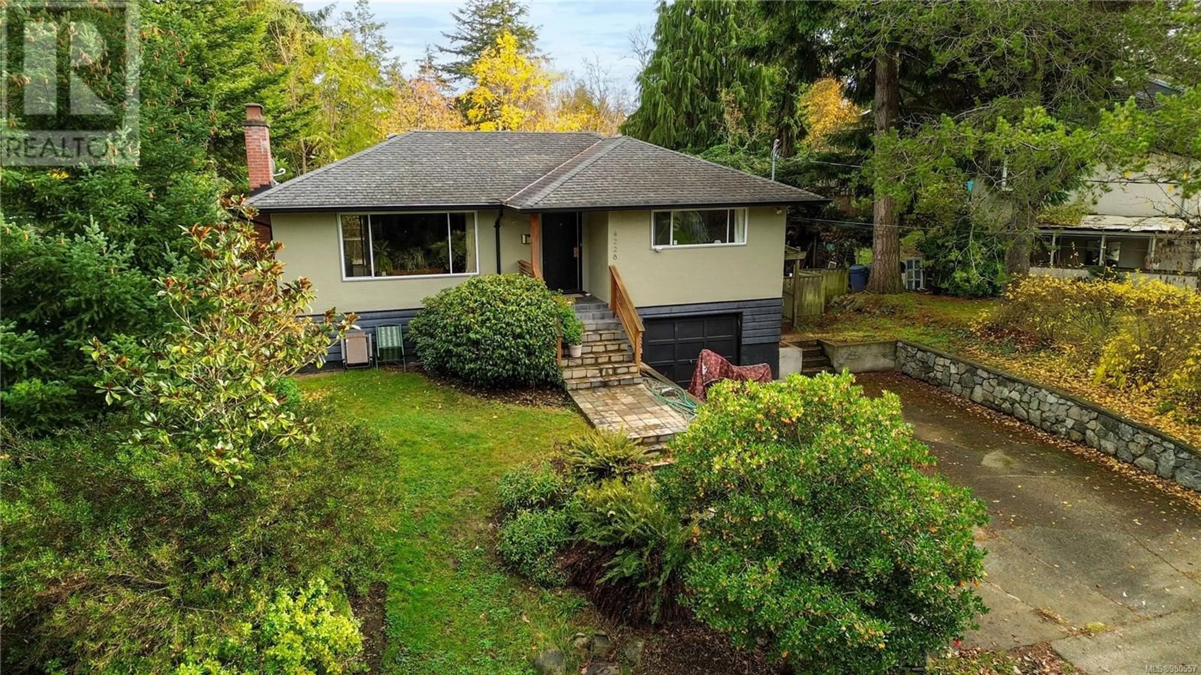 Frontside or backside of a home, cottage for 4228 Cedarglen Rd, Saanich British Columbia V8N4N6