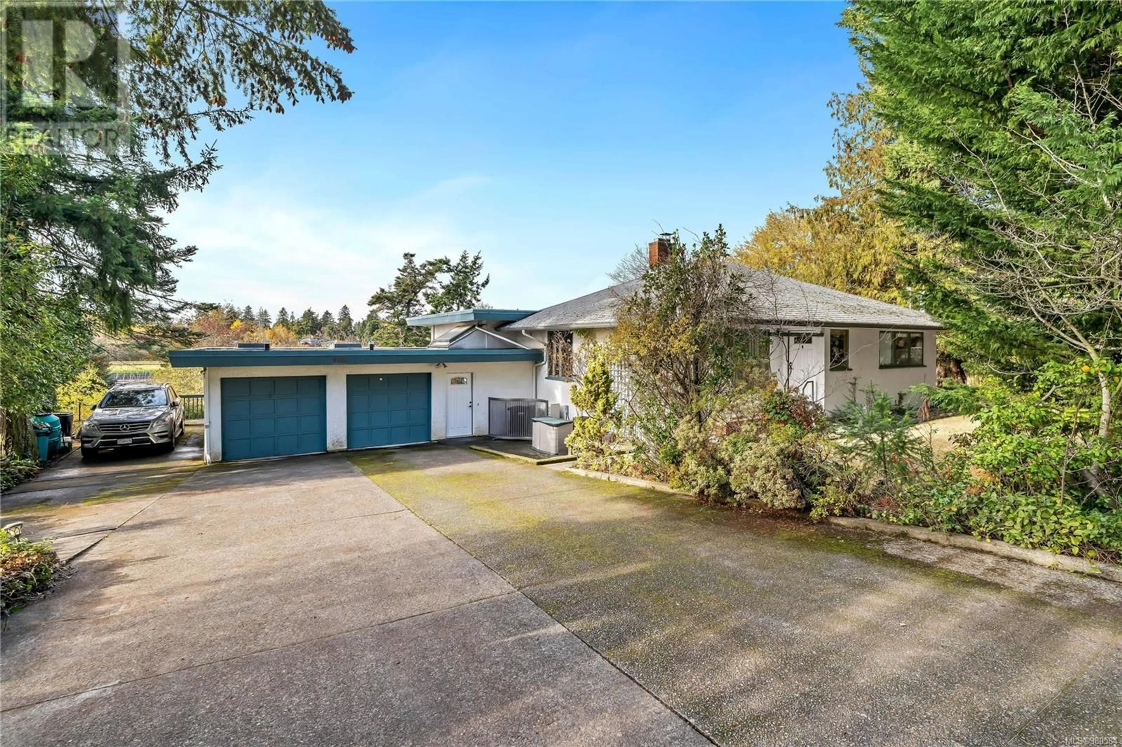 Frontside or backside of a home, cottage for 4186 Blenkinsop Rd, Saanich British Columbia V8X2C4